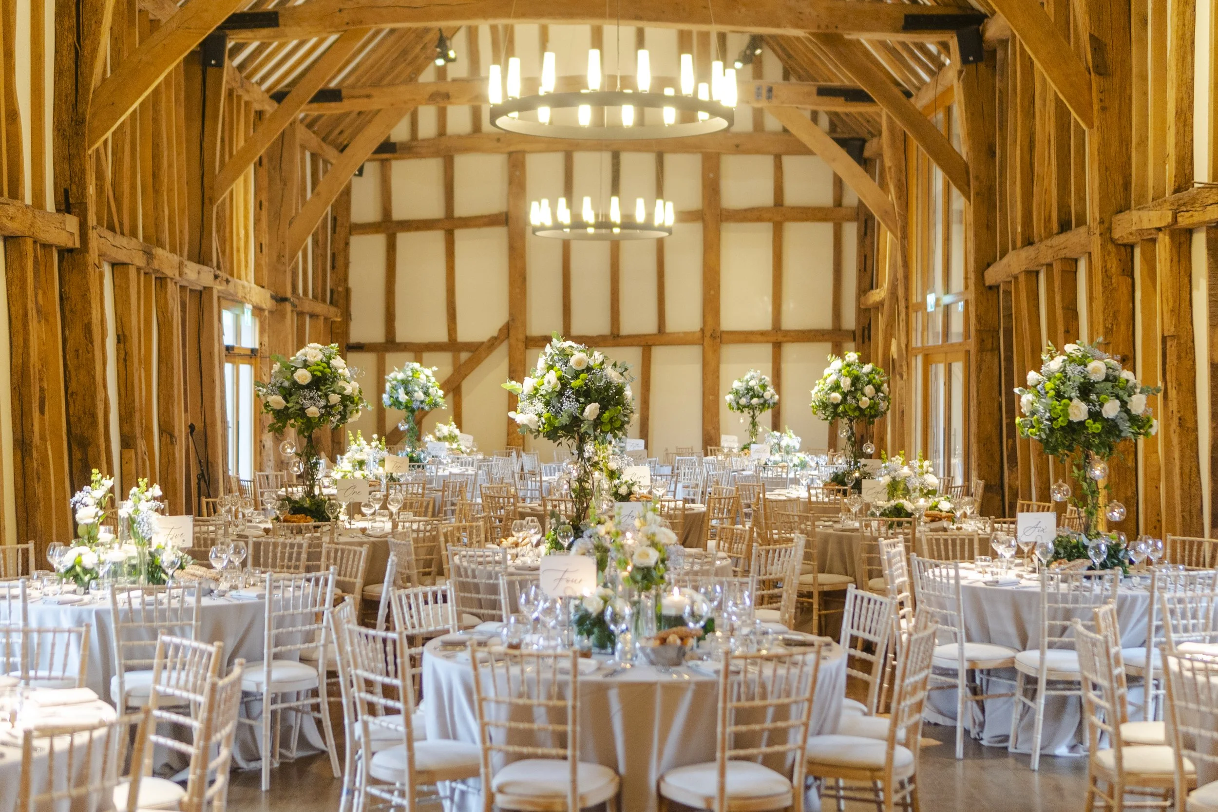 Wedding reception set up in the barn at a Micklefield Hall Wedding