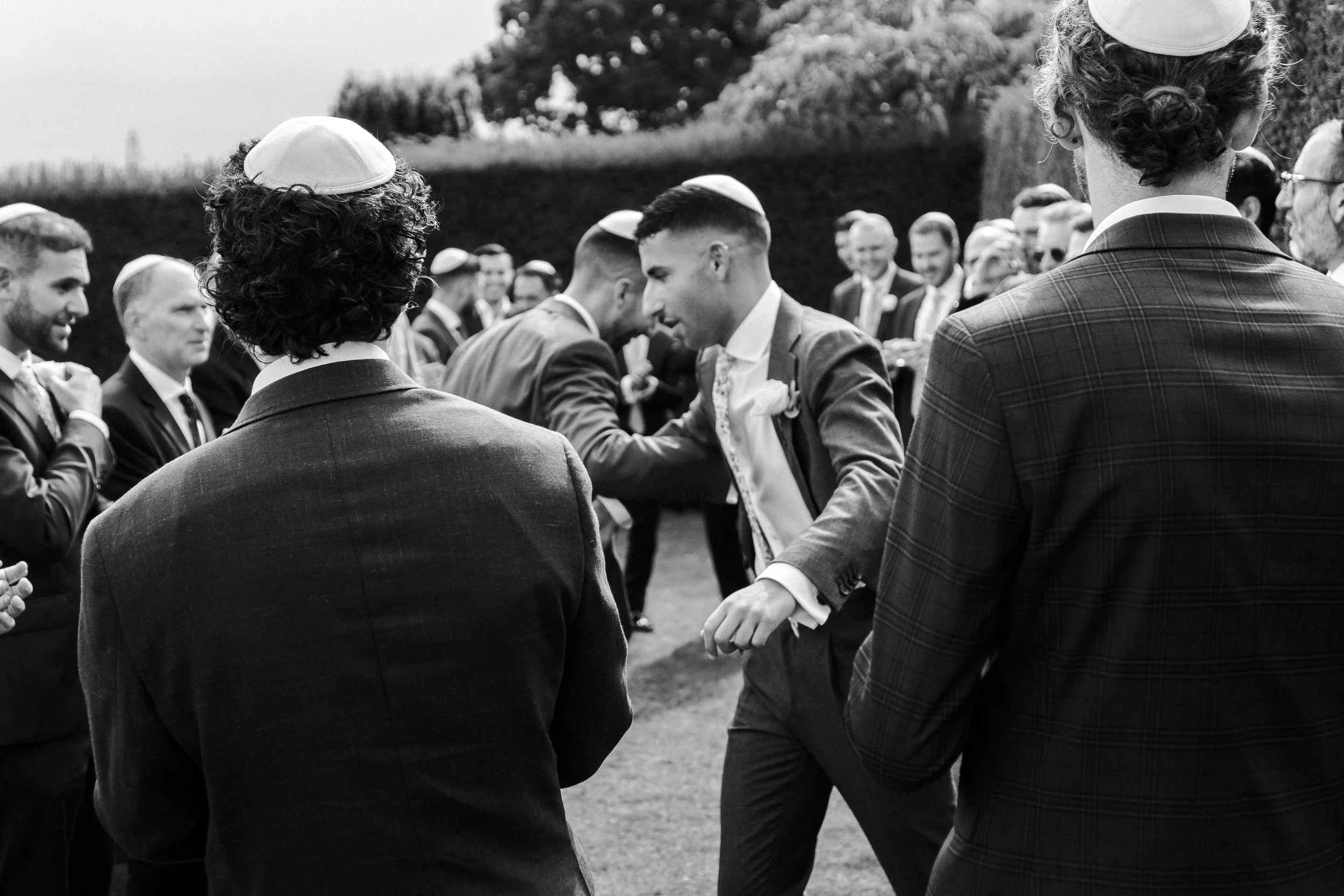 Groom and brother doing a traditional Jewish dance at a Micklefield Hall Wedding