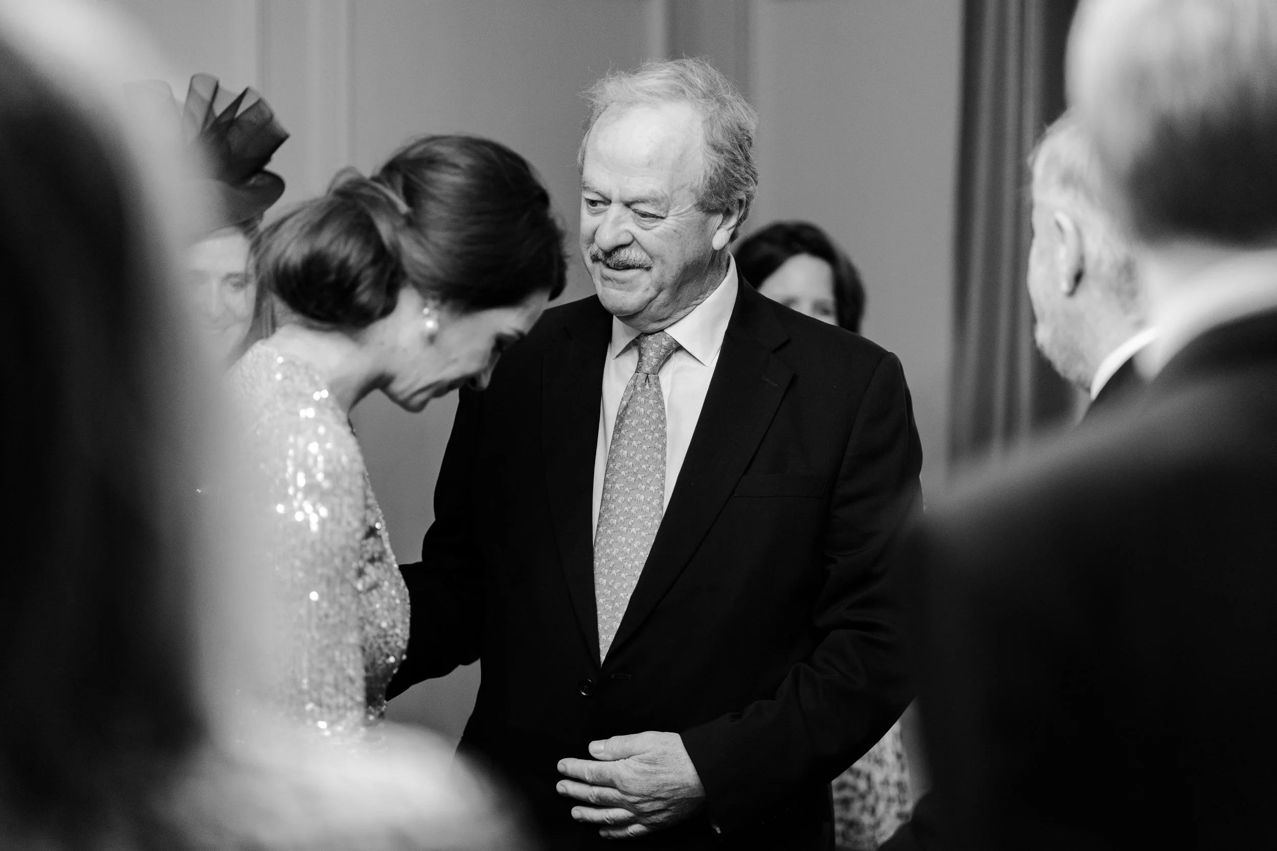 Groom's father congratulating Bride in the ceremony room at the Old Marylebone Town Hall