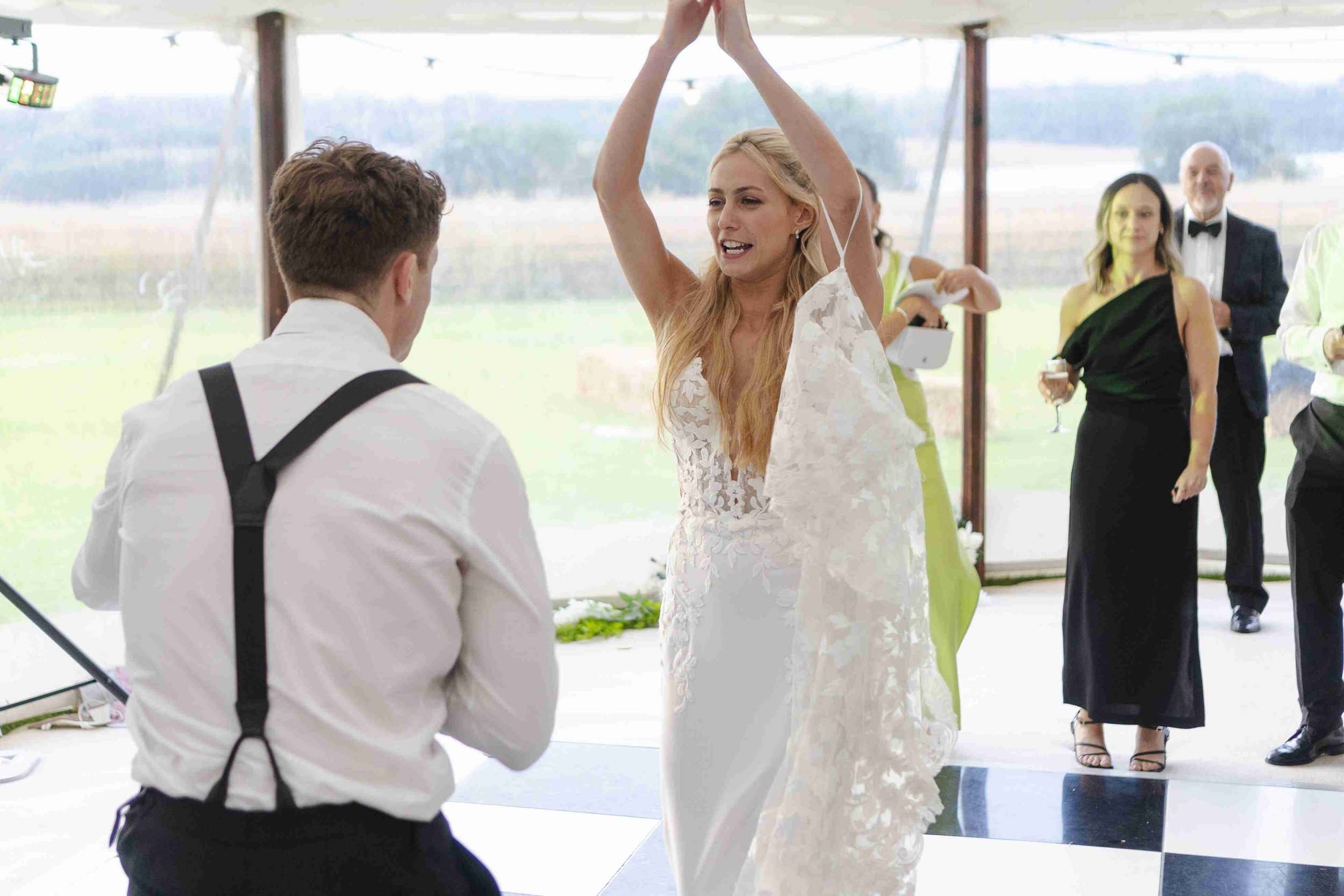 Bride dancing in front of the groom on the dance floor at the Halfmoon Farm Wedding in Rutland