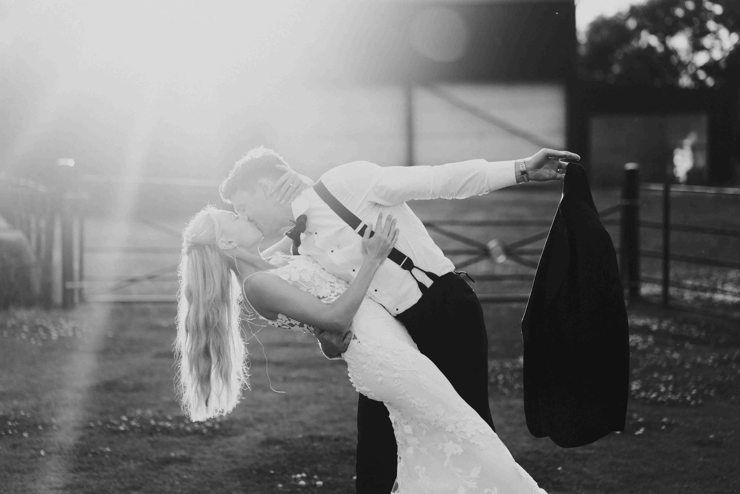 Rutland Wedding Photography with the couple kissing while the groom is dipping the bride at the Halfmoon Farm Wedding in Rutland