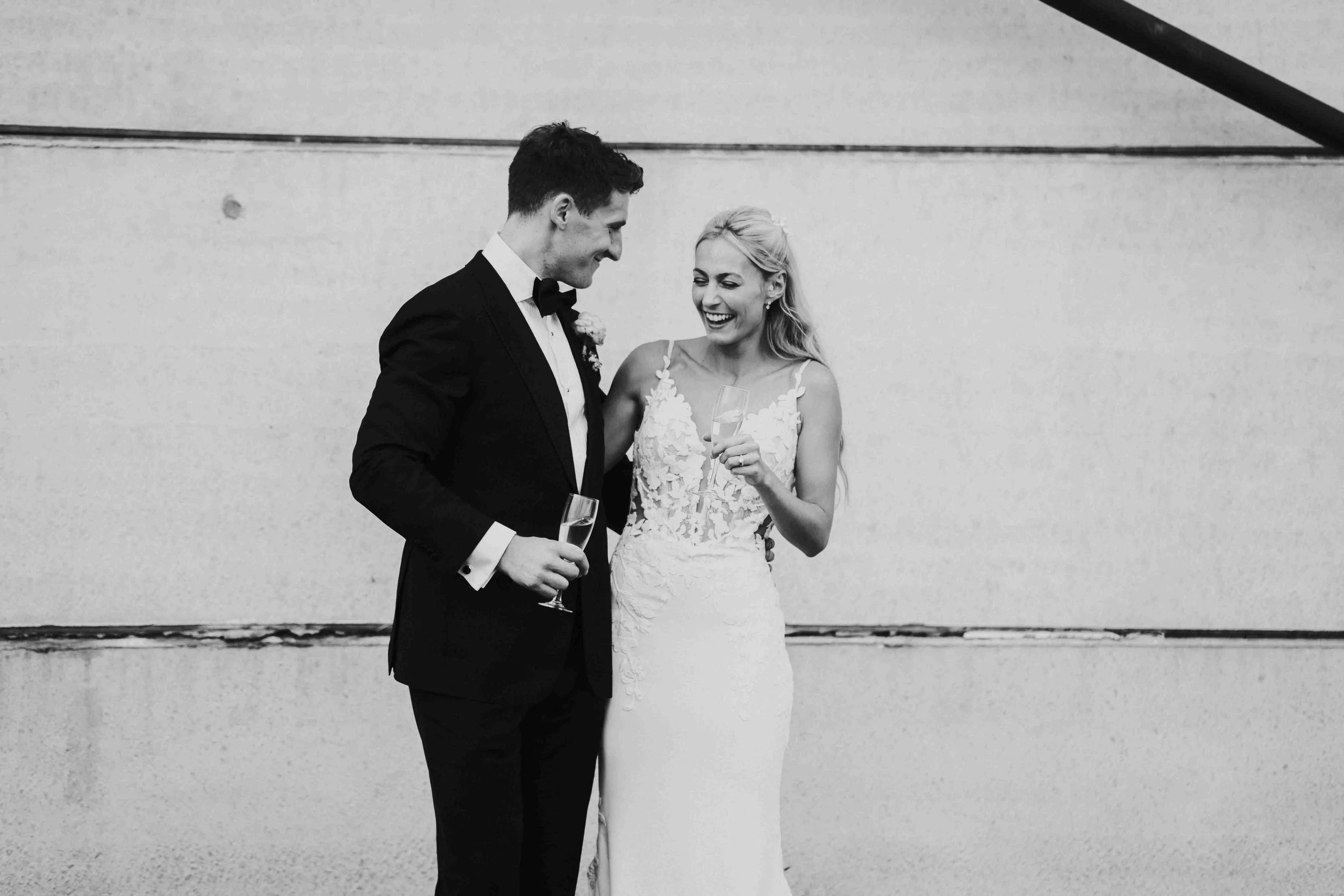 Couple laughing outside at the Halfmoon Farm Wedding in Rutland