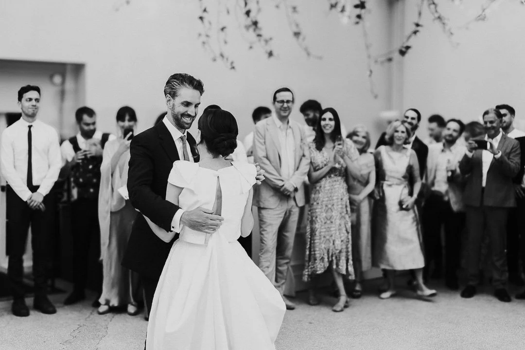 Wedding couple perform their first dance on the dancefloor at a Hampton Court House Wedding.
