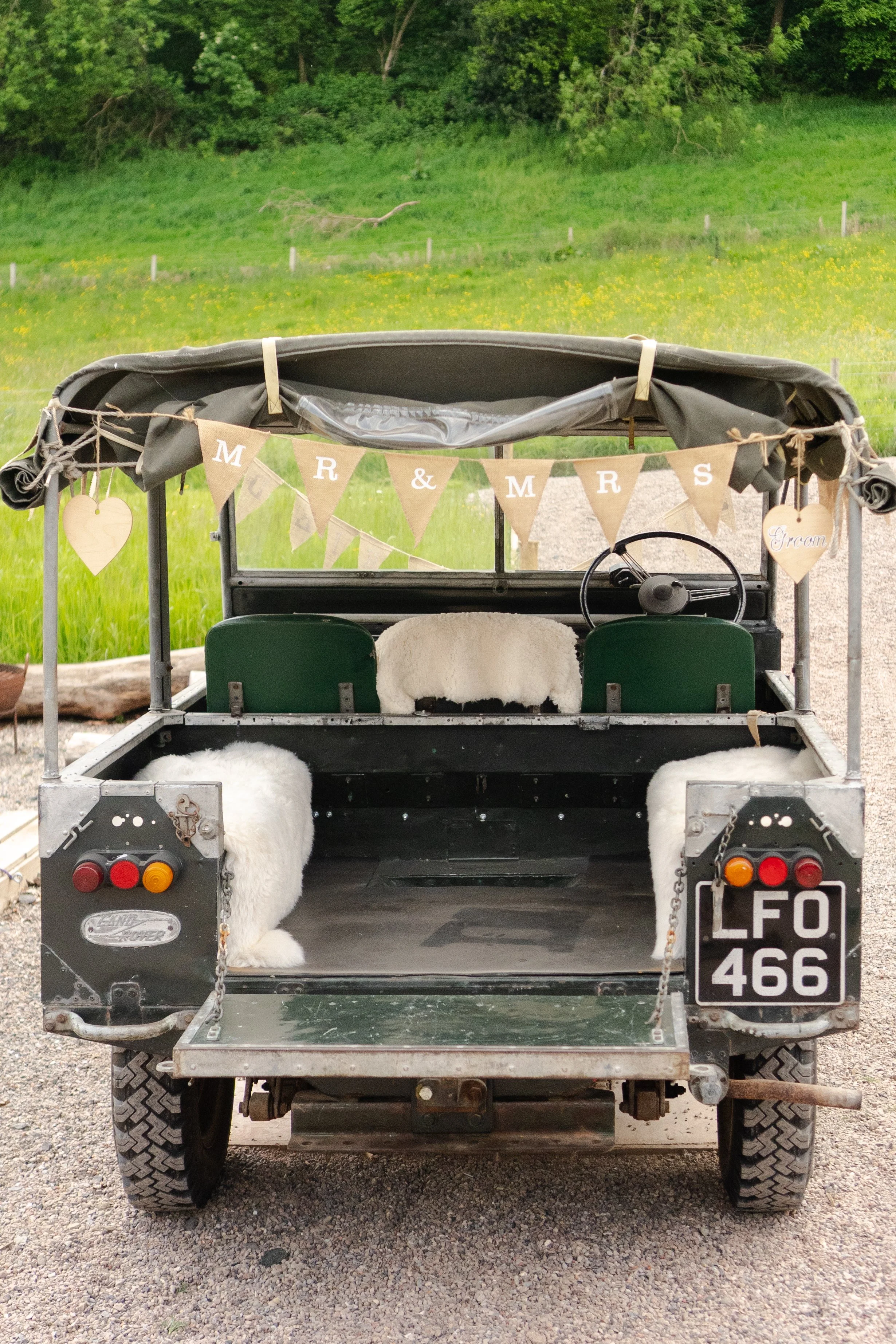 Open Back Land Rover Car with a MR & MRS bunting at a rhyse farm wedding