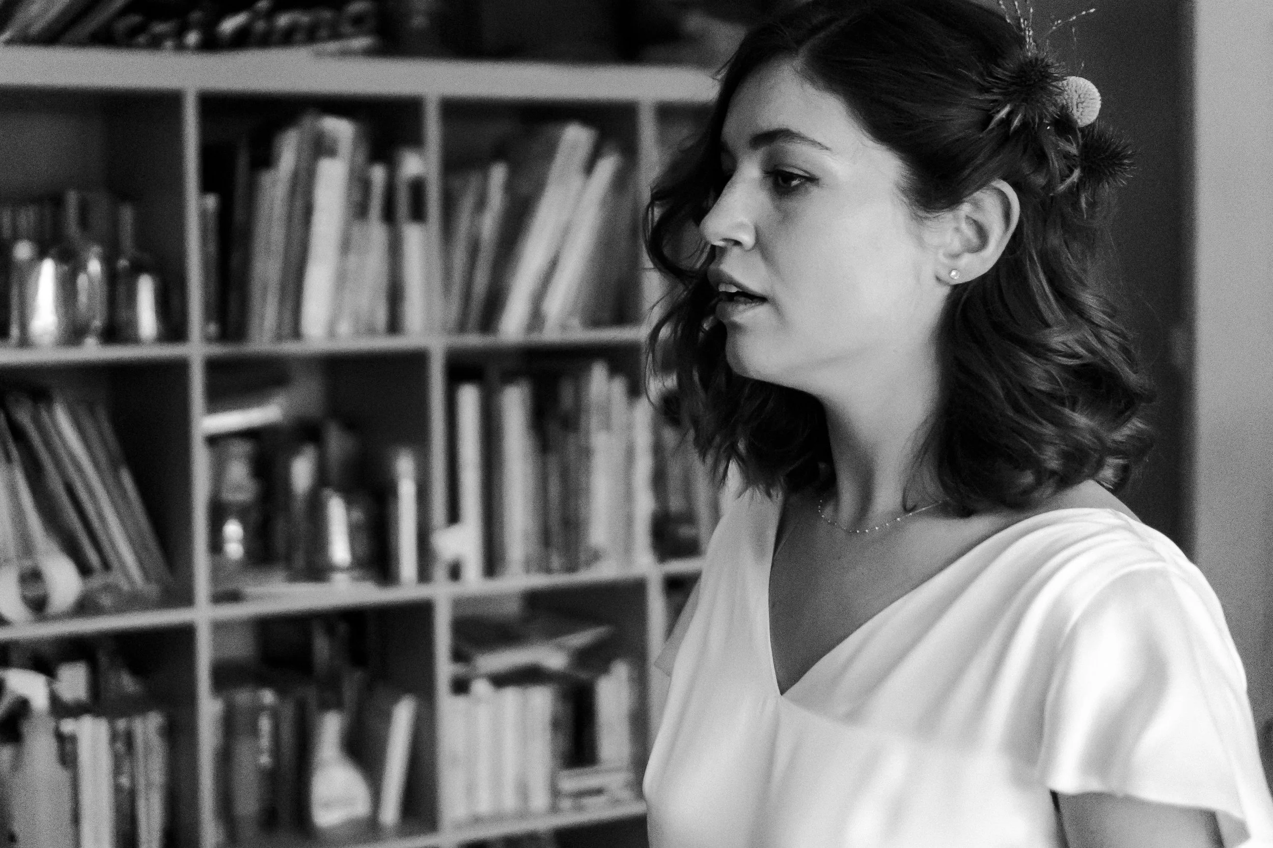 Bride standing in a empty room looking into a mirror before a Highgate, London Wedding