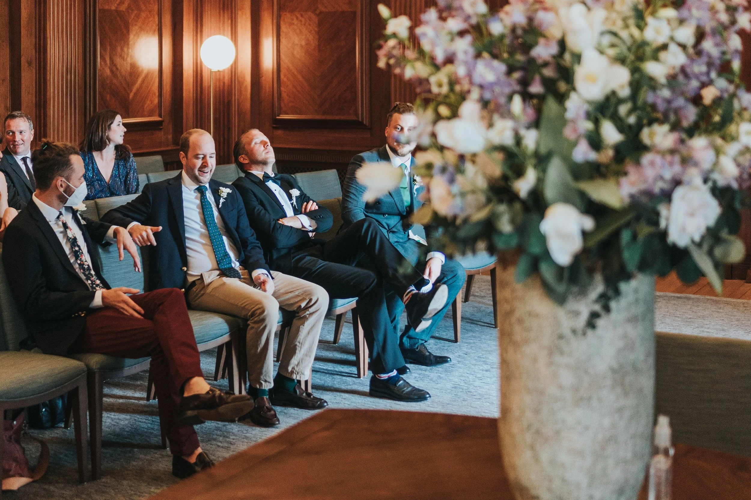 Guests sitting in the wedding ceremony room before a Old Marylebone Town Hall Wedding