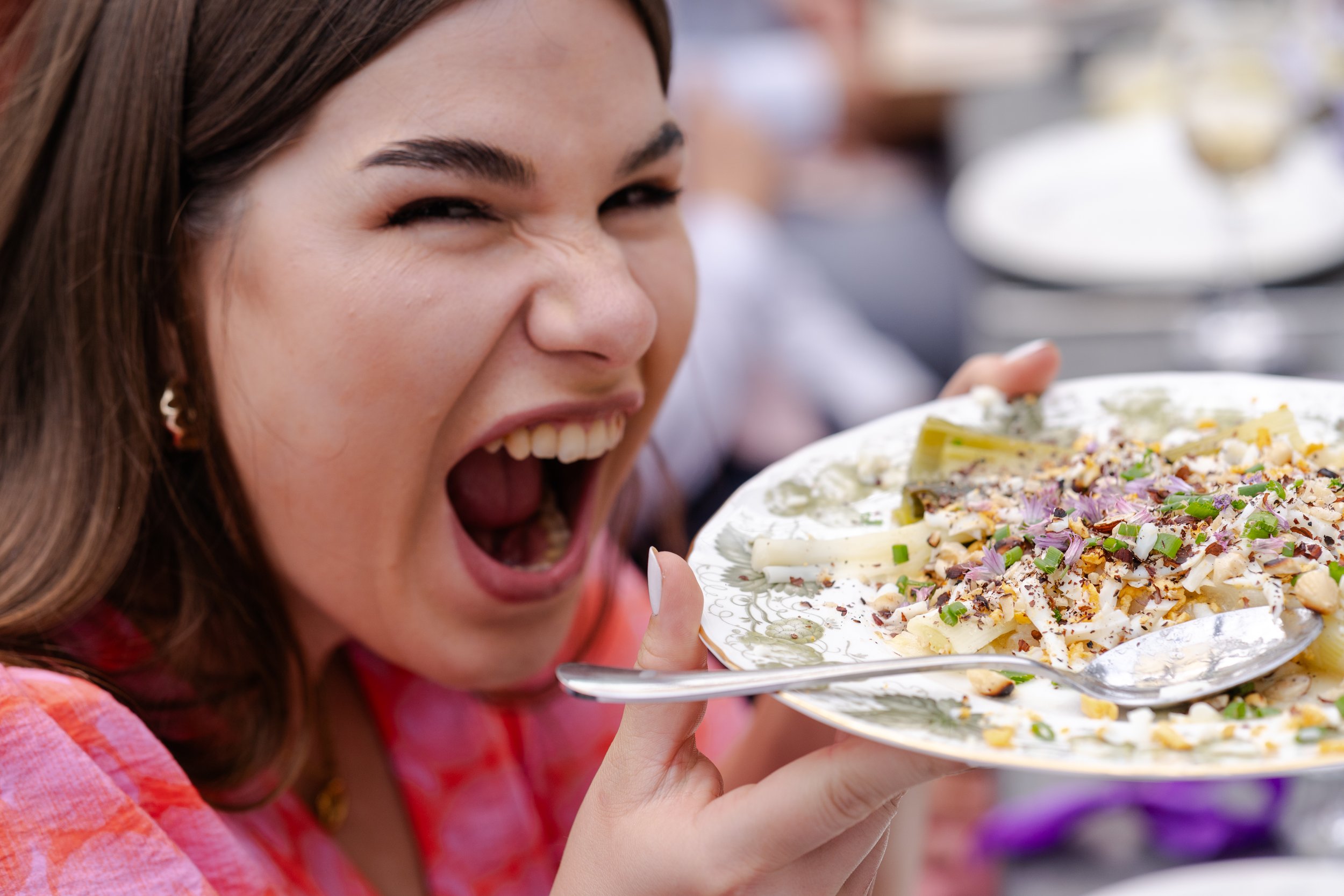 Wedding Guests with serving platter pretending to eat the plate at a Worton Kitchen Garden, Oxfordshire Wedding.