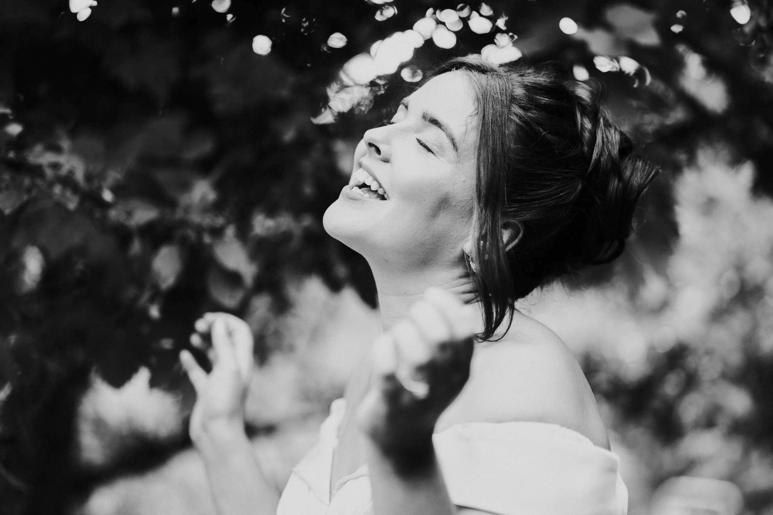 Bride looking up to the sky smiling at a Worton Kitchen Garden, Oxfordshire Wedding.