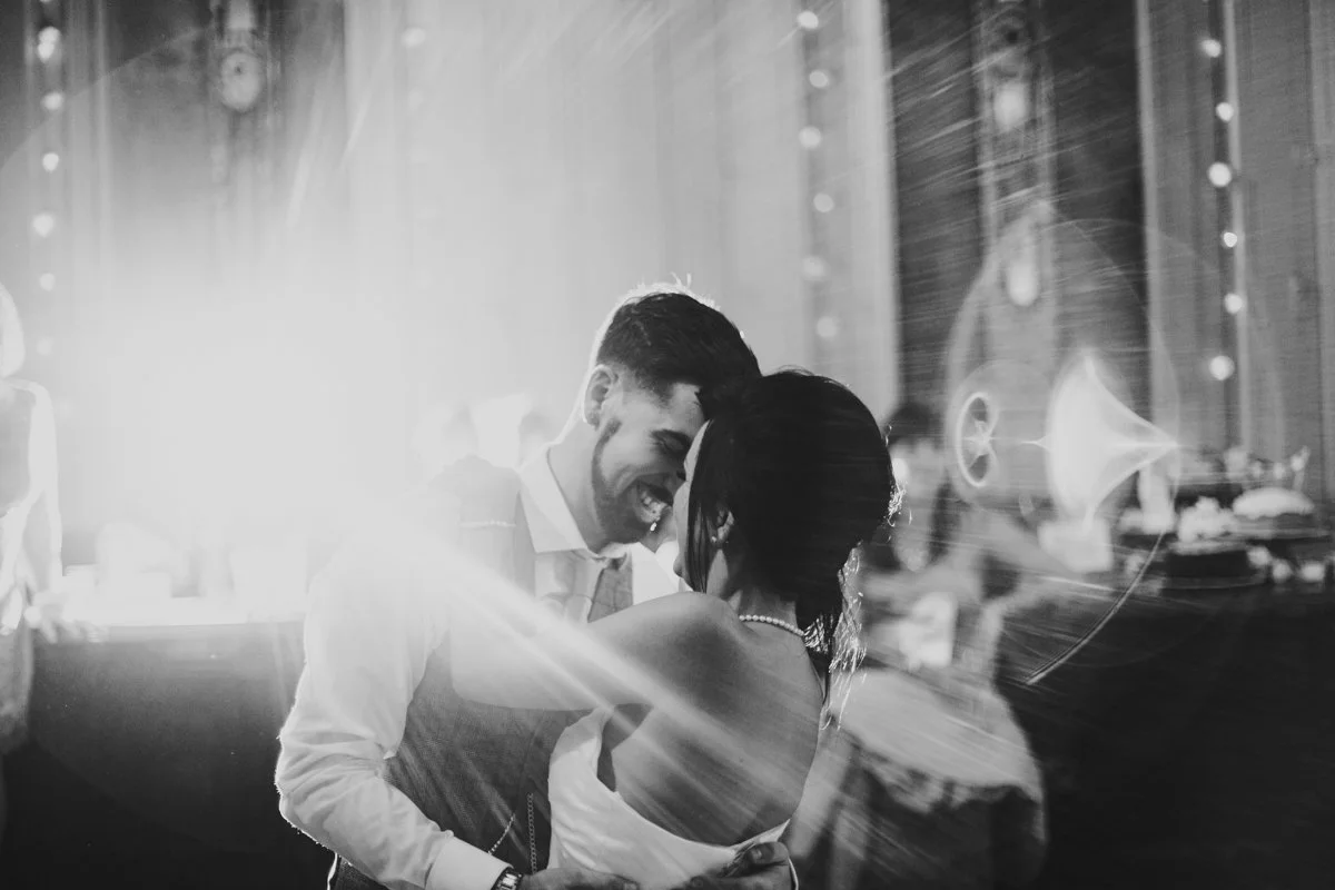 The bride & Groom dancing very close for their first dance at the iconic The Old Queens Head pub, Essex Road, Islington at a London Wedding