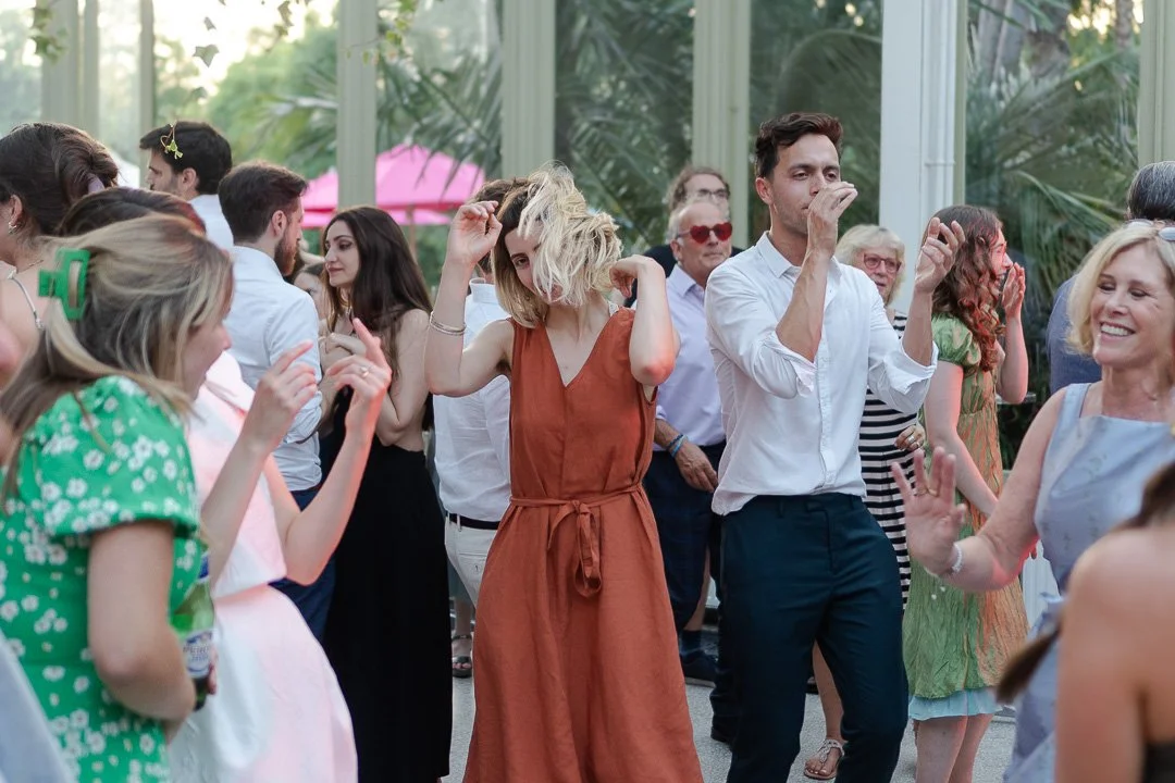 Guests on the dancefloor dancing at a Hampton Court House Wedding.