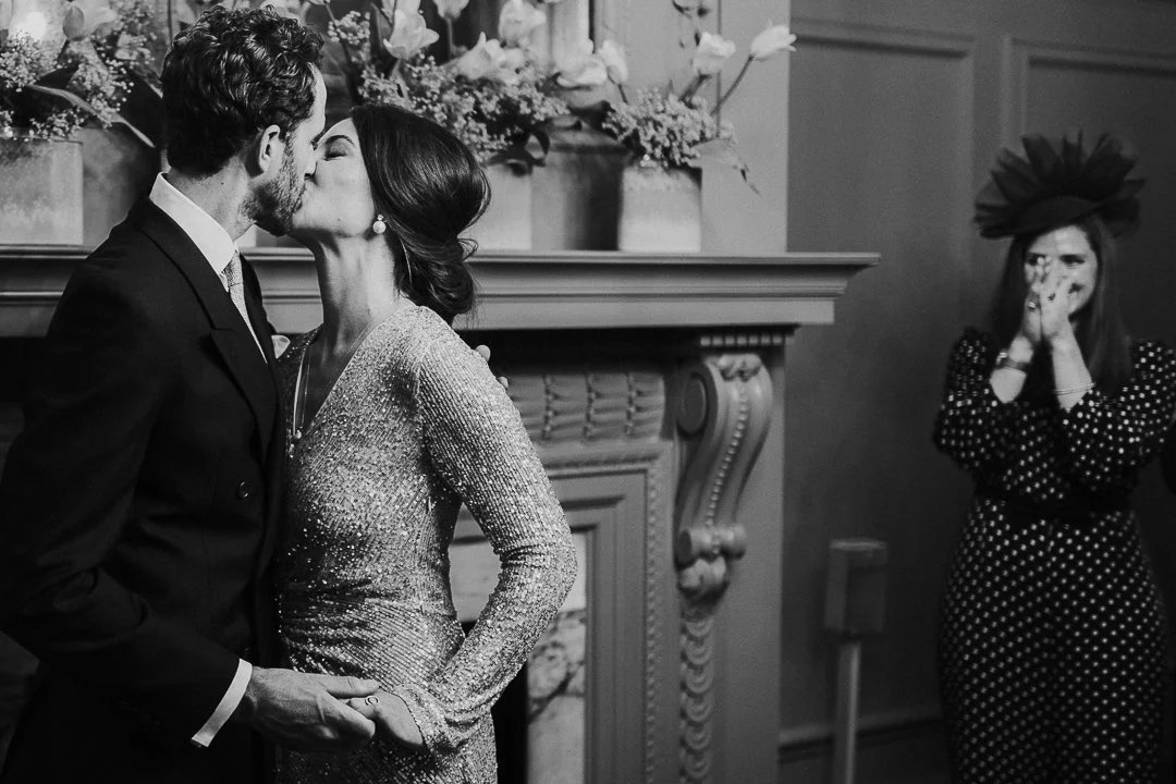 Couple sharing their first kiss in the ceremony room at the Old Marylebone Town Hall Wedding.