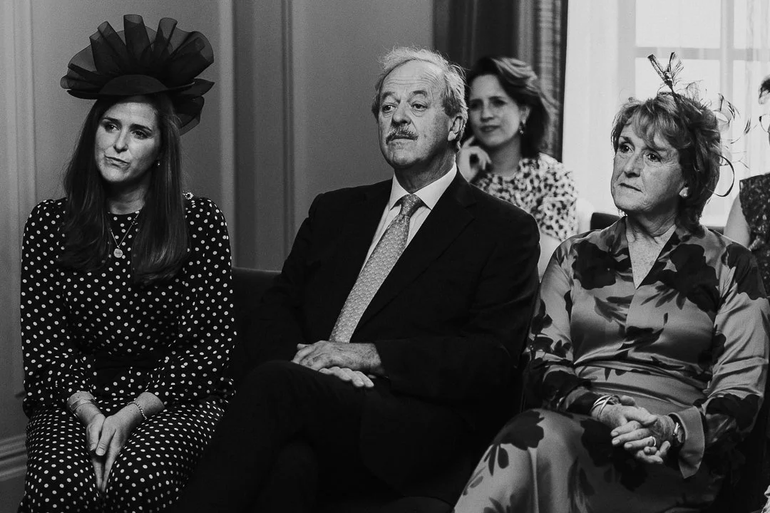 Groom's family sitting in front row watching the ceremony at the Old Marylebone Town Hall.