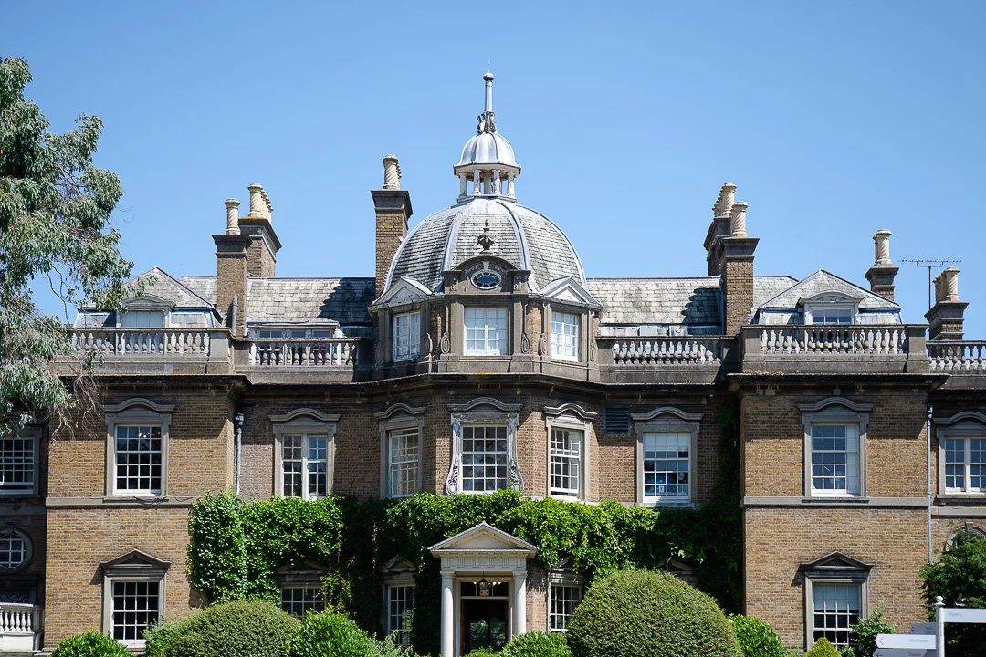 A front view image of the Hampton Court House on a sunny day at the London Venue