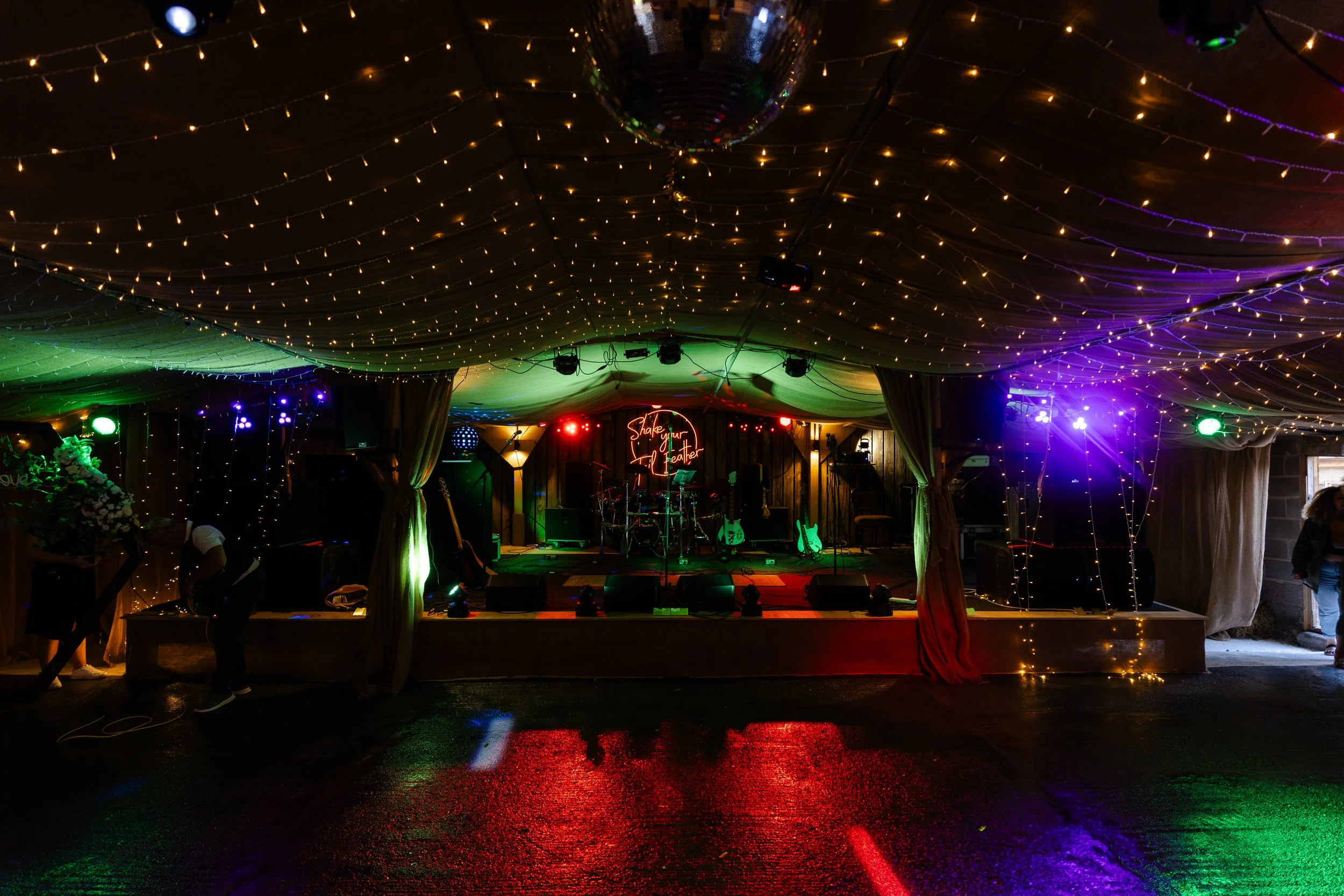Dance floor set up with lights at the wedding reception  at a rhyse farm wedding
