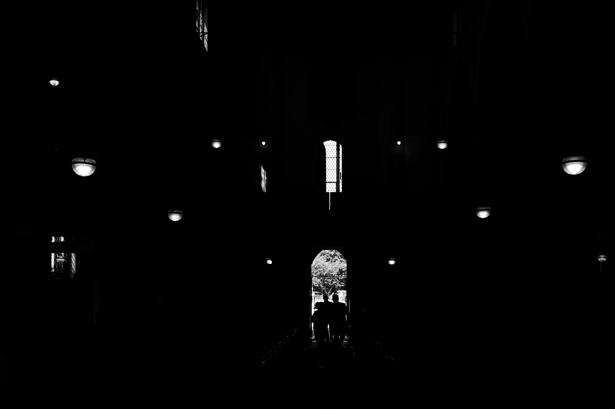 Silhouette of guests in St Michael's Church entrance for London Highgate Wedding Photography