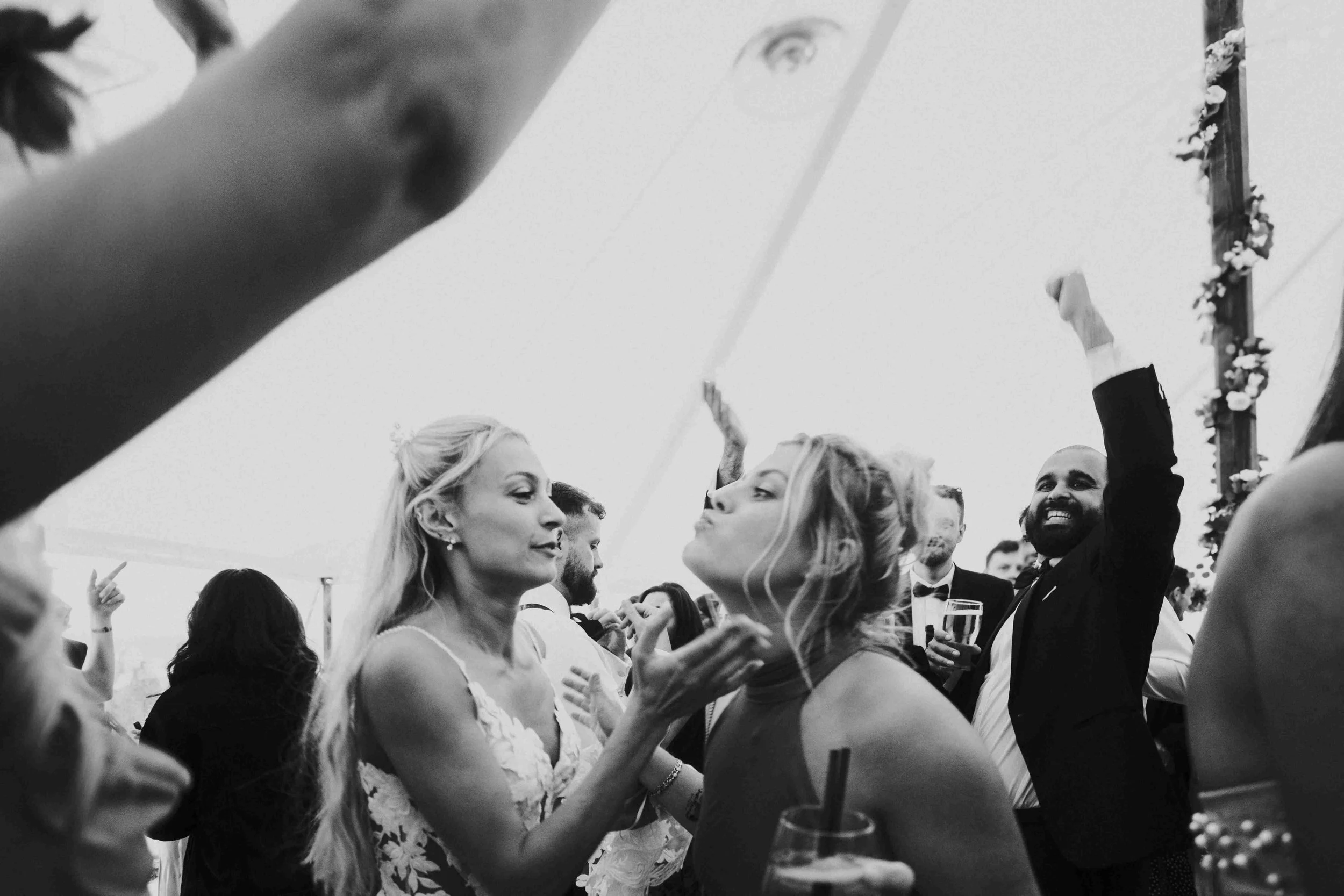 bride dancing with a guest on the dance floor at the Halfmoon Farm Wedding in Rutland