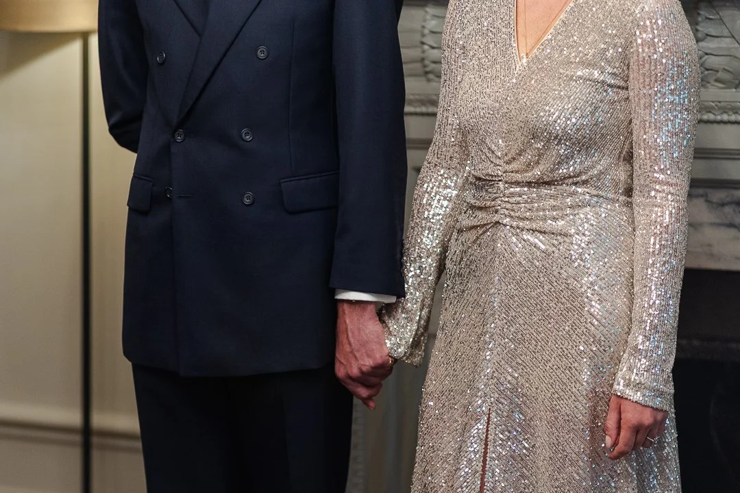 Colour image of just the couple holding hands in the ceremony room at the Old Marylebone Town Hall Wedding.