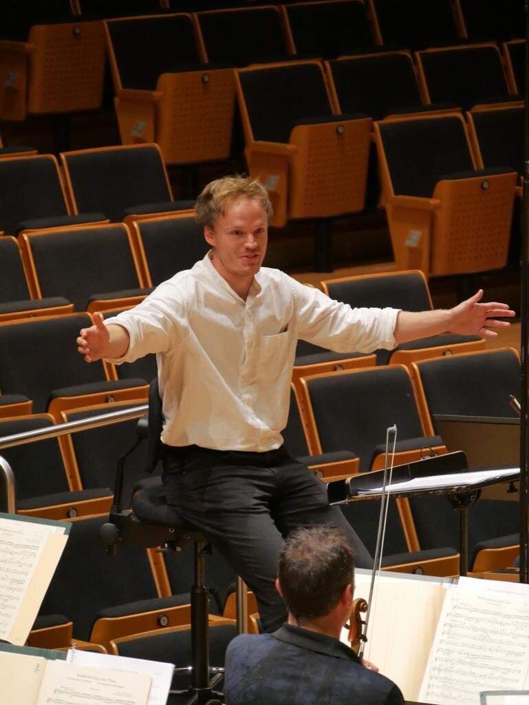 Finnegan Downie Dear conducting the Bamberg Symphony Orchestra during the season opening concerts on September 17, 18 &amp; 20.
