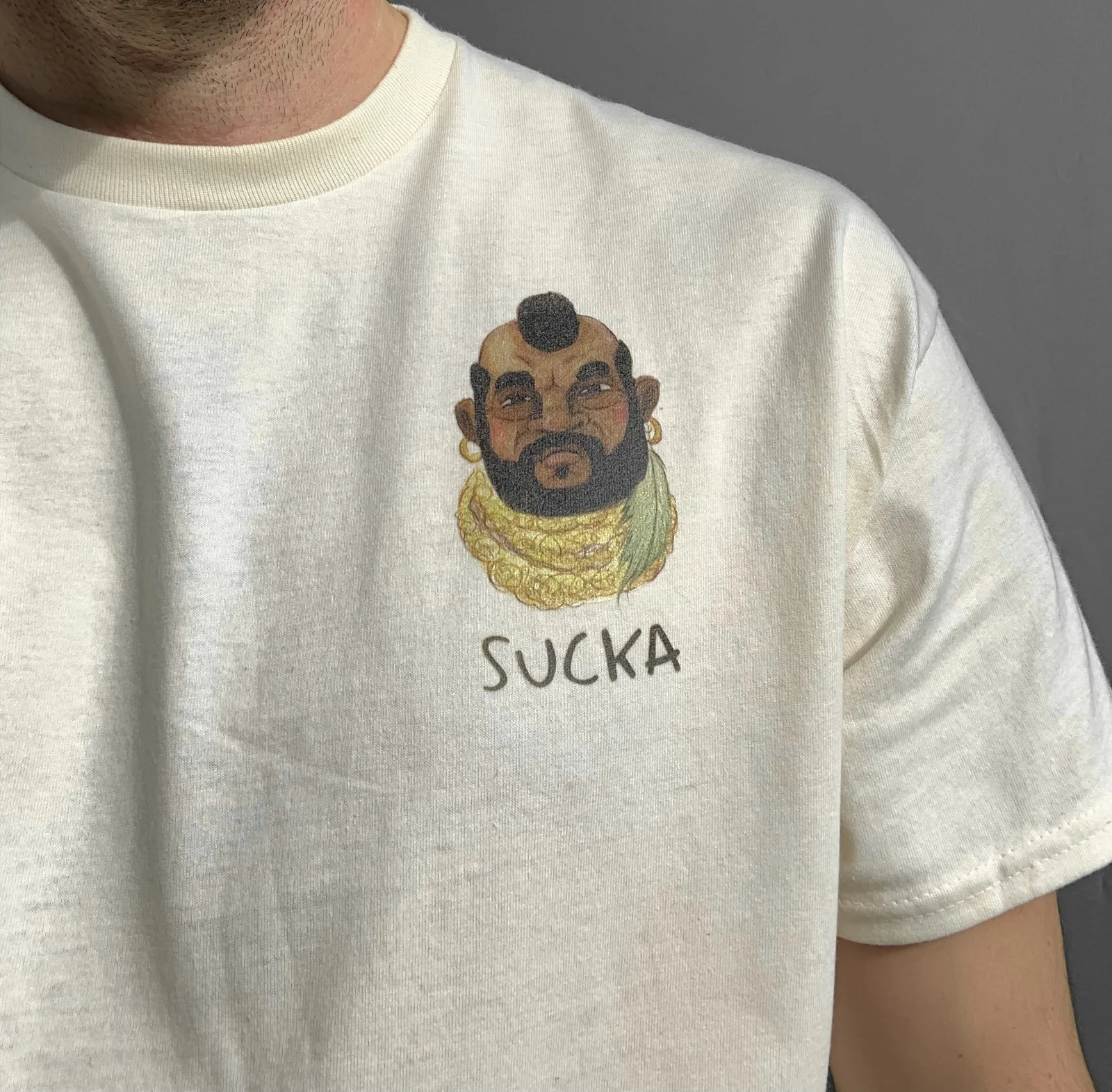 MrT-ateam-sucka-80s-vintage-retro-fashion-textiles-for-men-tshirt-gifts-for-men-80s-retro-vintage-nostalgia-pop-culture-shirt-tee-embroidered-badge-close-up-model-5.jpg