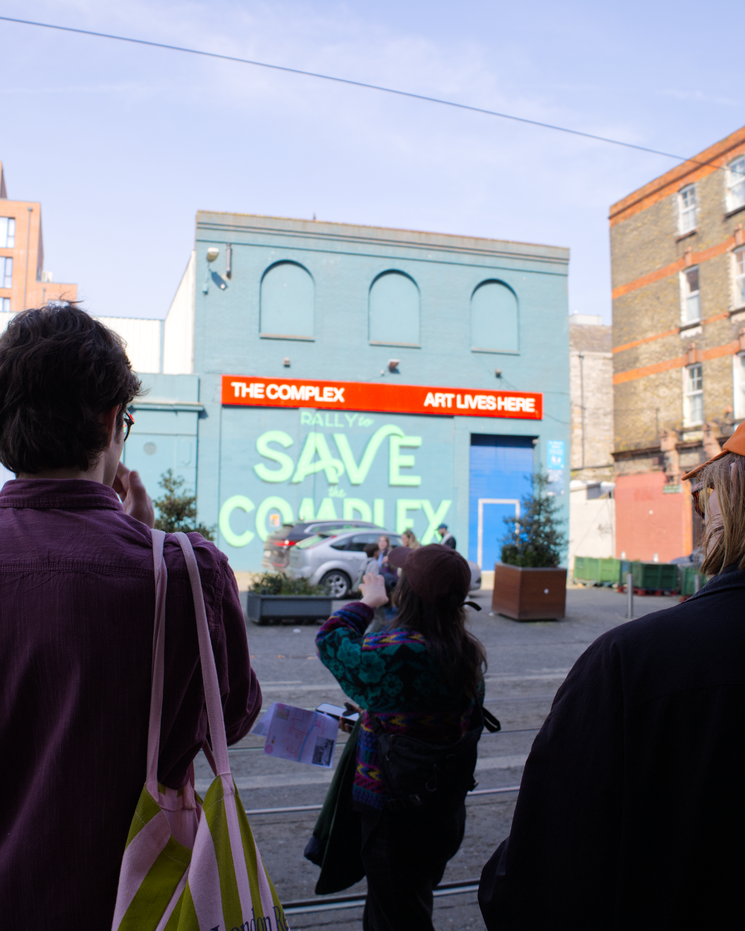 Outside Holly Pereira's 'Save the Complex' mural, The Complex's building just off Capel Street