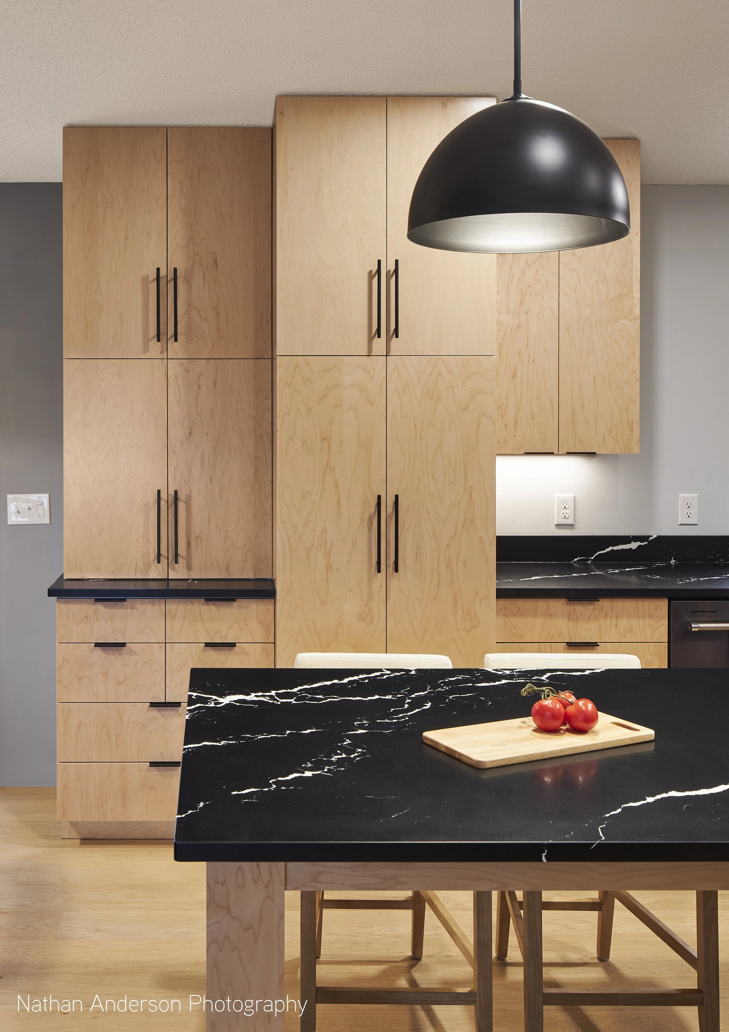 Dedicated space for each use - Coffee, Pantry, Seating.  The kitchen is zoned for specific uses, but also incorporates the traditional Use Triangle.