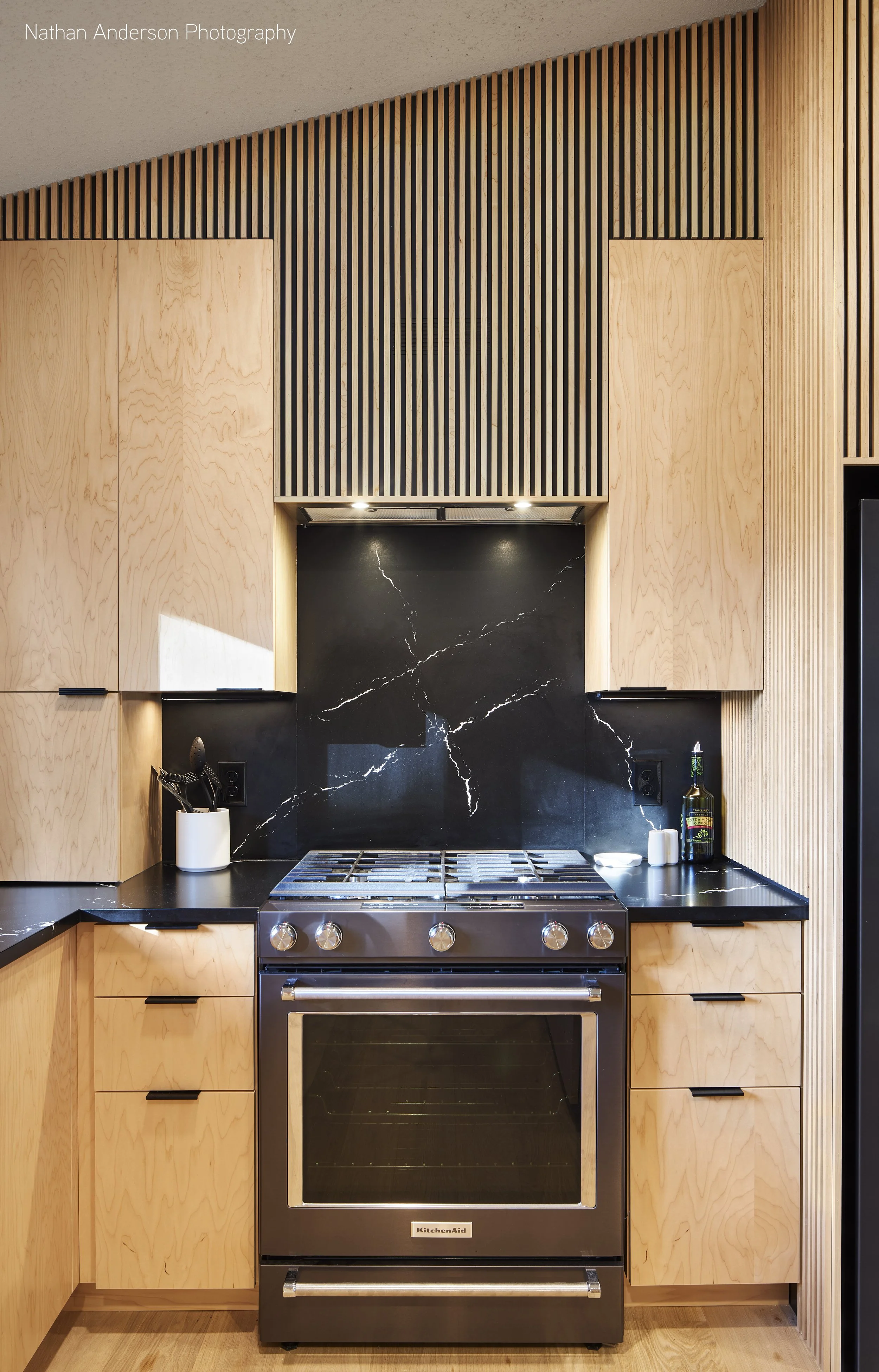 Everything in its right place - spice cabinet, utensil drawer, slide-in range, and a hidden vent hood (can you find the exhaust?).
