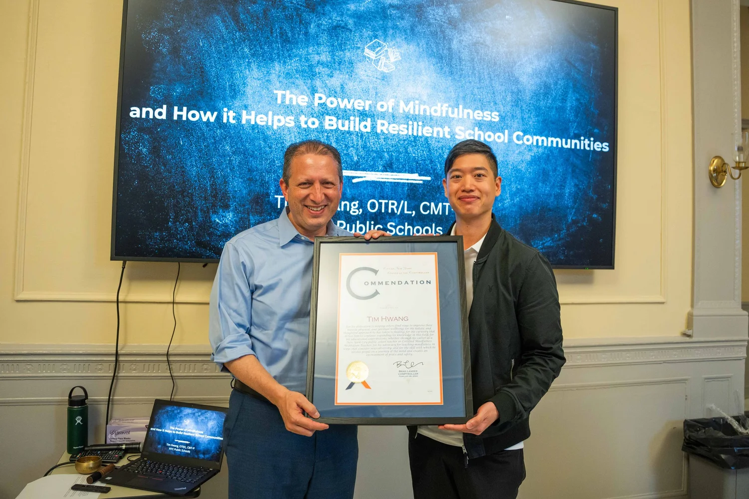 Tim Hwang receiving a commendation for mindfulness work in NYC public schools