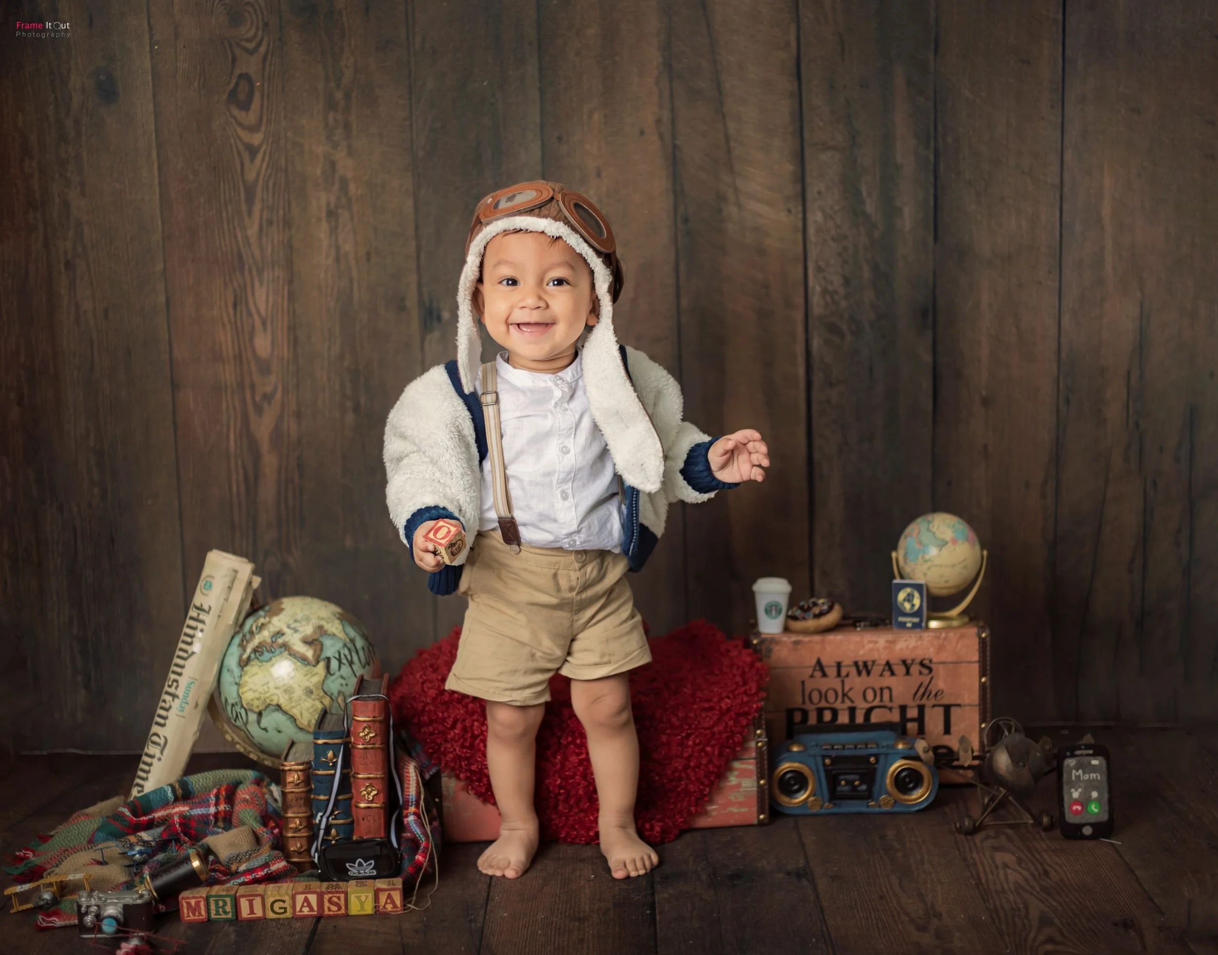 Sitter baby photography session with themed setups at Frame It Out Photography studio in Faridabad, serving Delhi NCR families