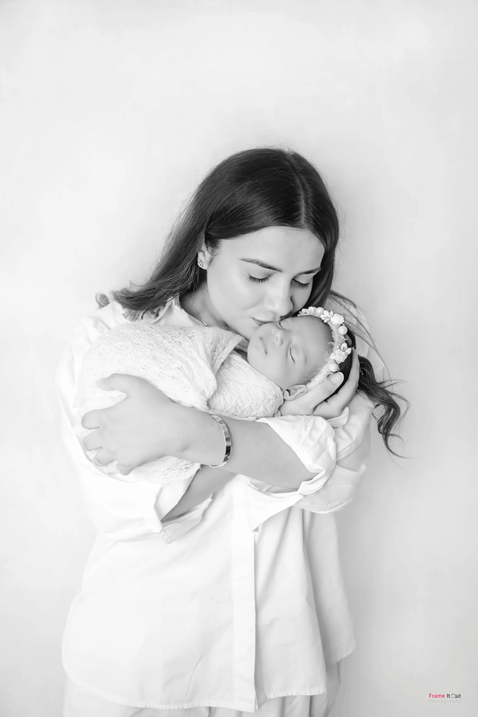 Luxury newborn photography with parents in Delhi NCR by Frame It Out