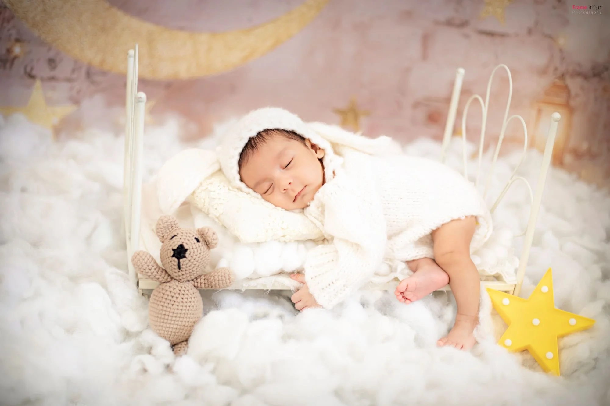 Elegant newborn baby portrait styled with warmth and simplicity