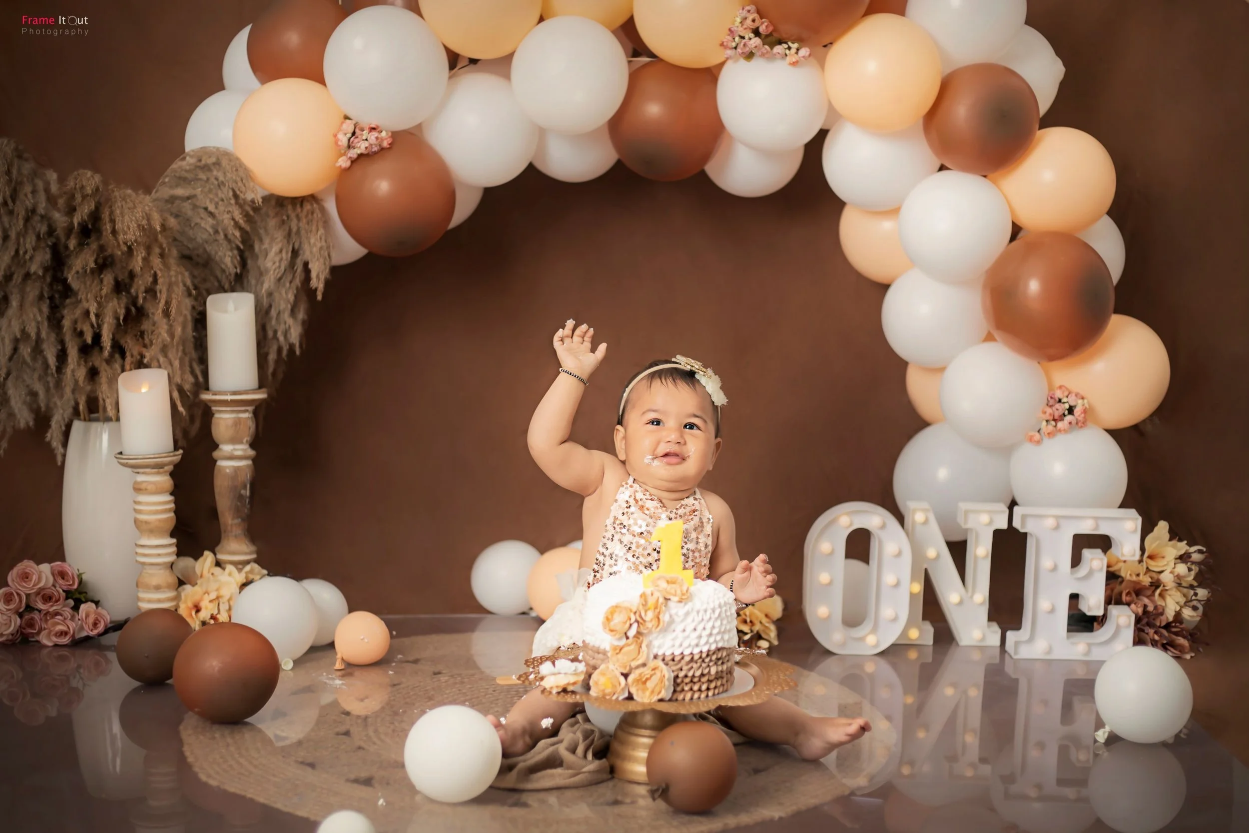 Creative themed cake smash photoshoot at Frame It Out Photography studio
