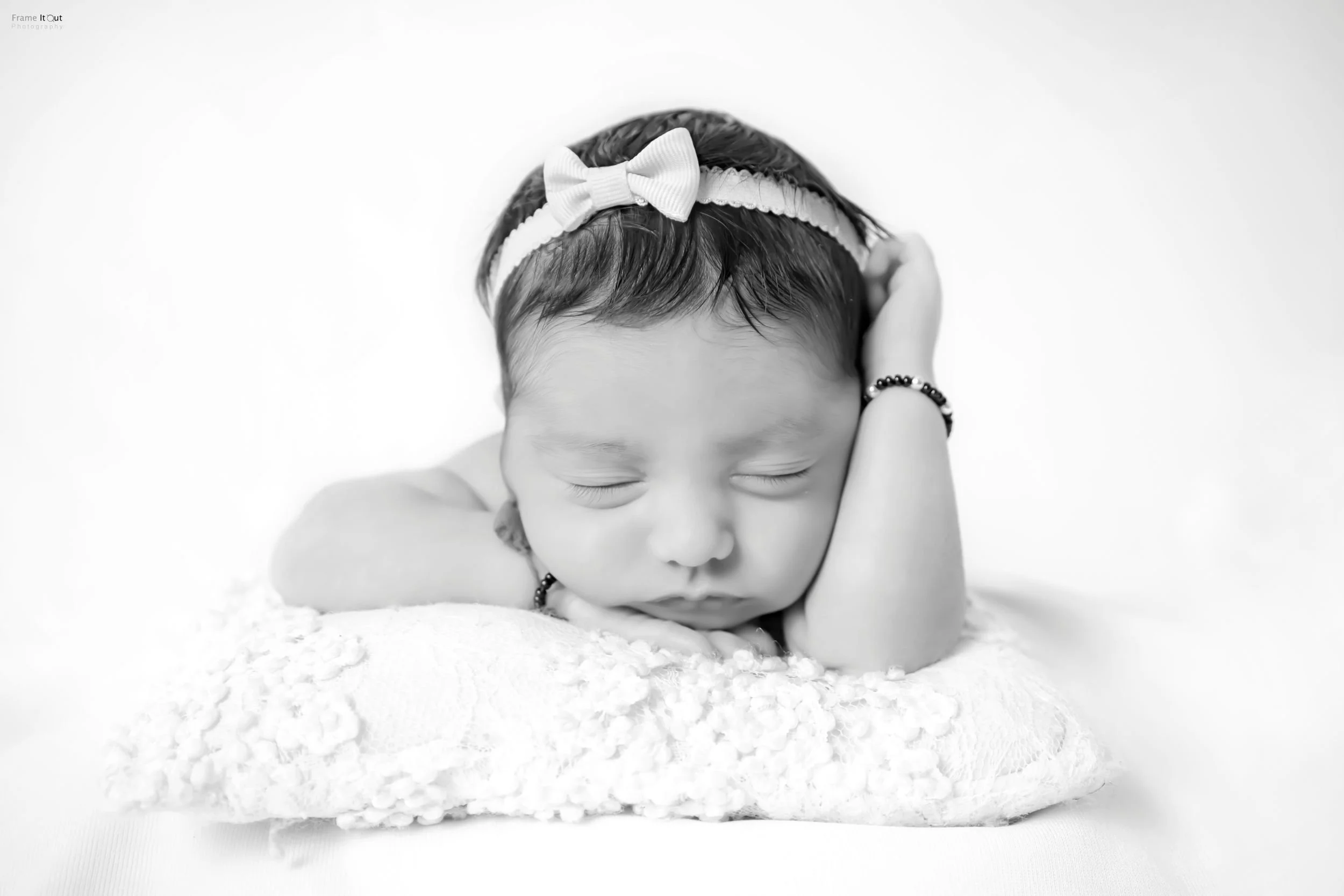 Newborn baby face close-up in black and white