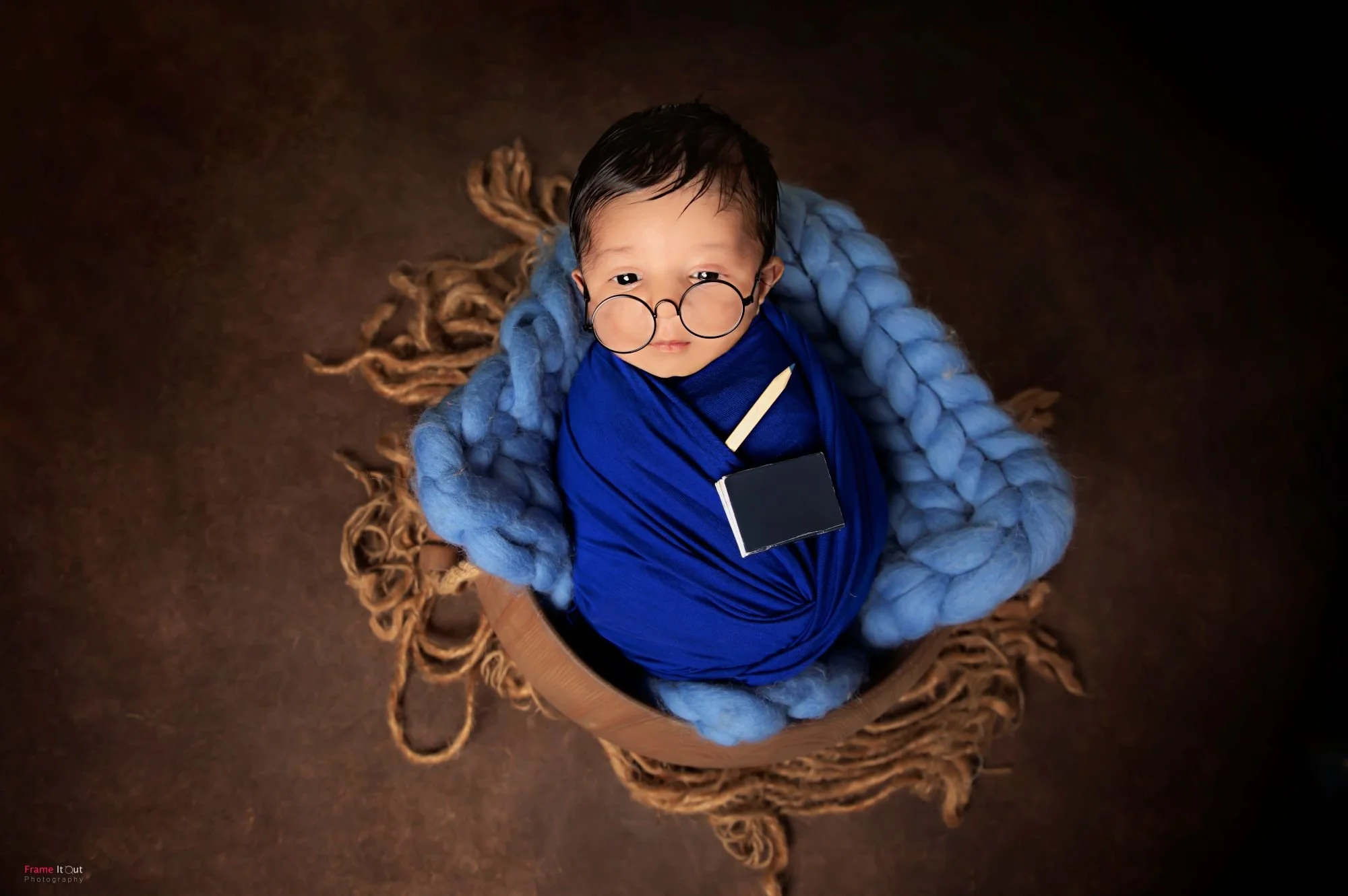 Professional newborn baby portrait captured with gentle care and safety
