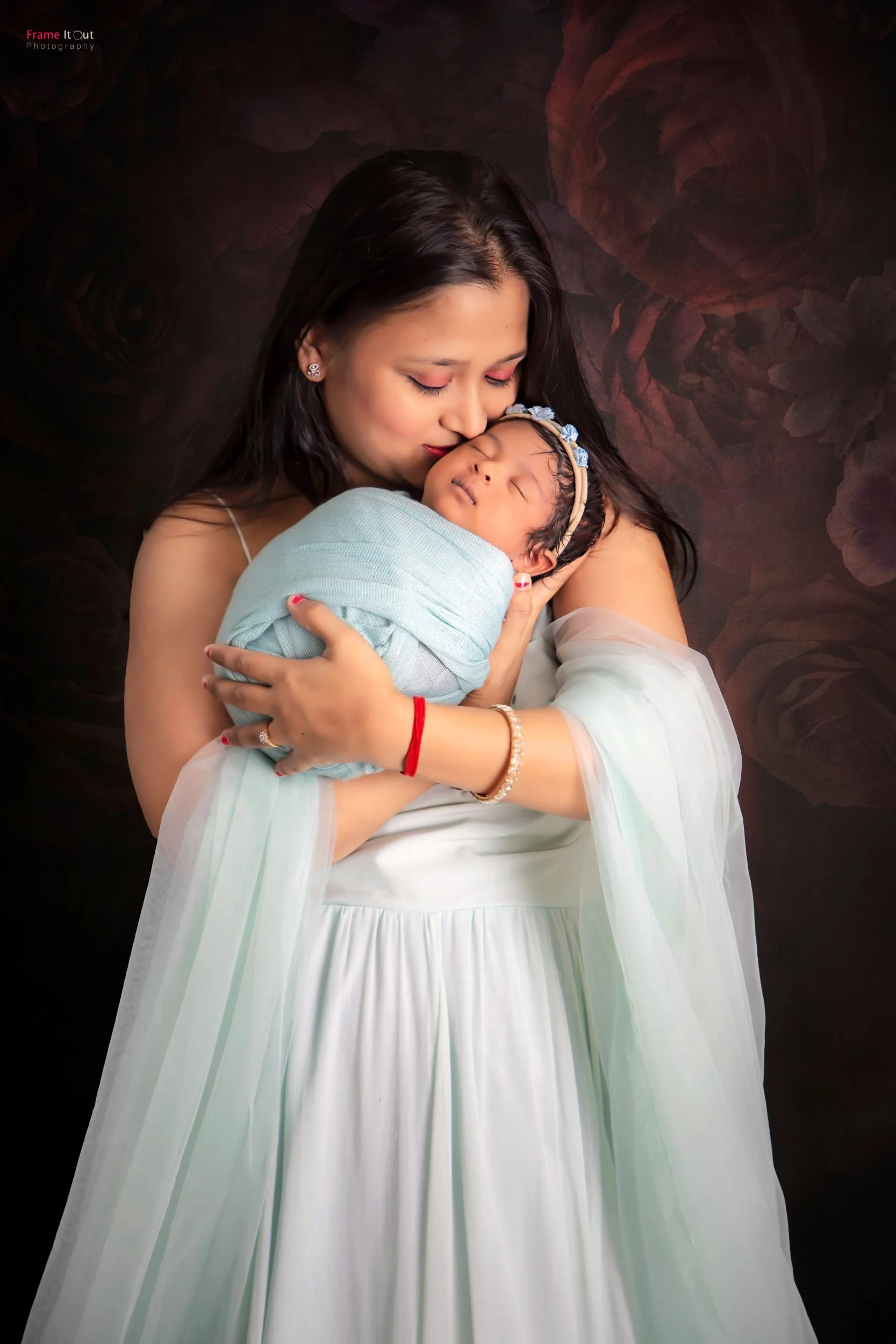 Newborn baby with mother portrait