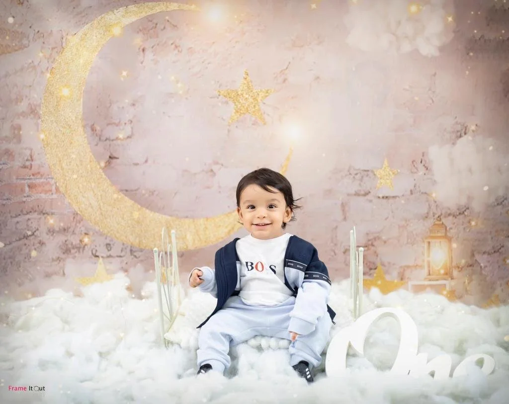 Sitter baby photography session highlighting personality and expressions at Frame It Out Photography studio in Faridabad, Delhi NCR