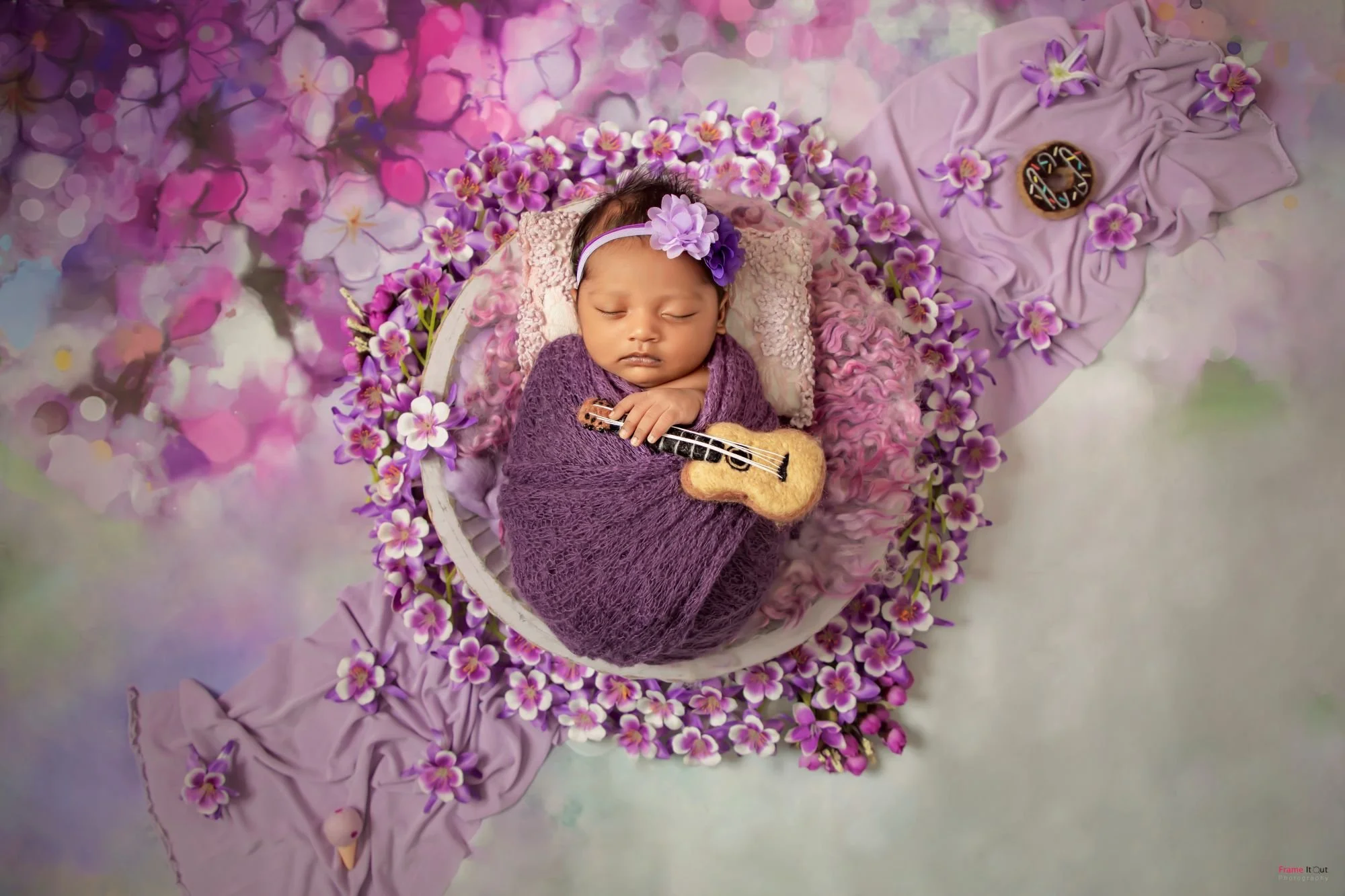 Newborn baby photography showcasing expert wrapping and gentle posing