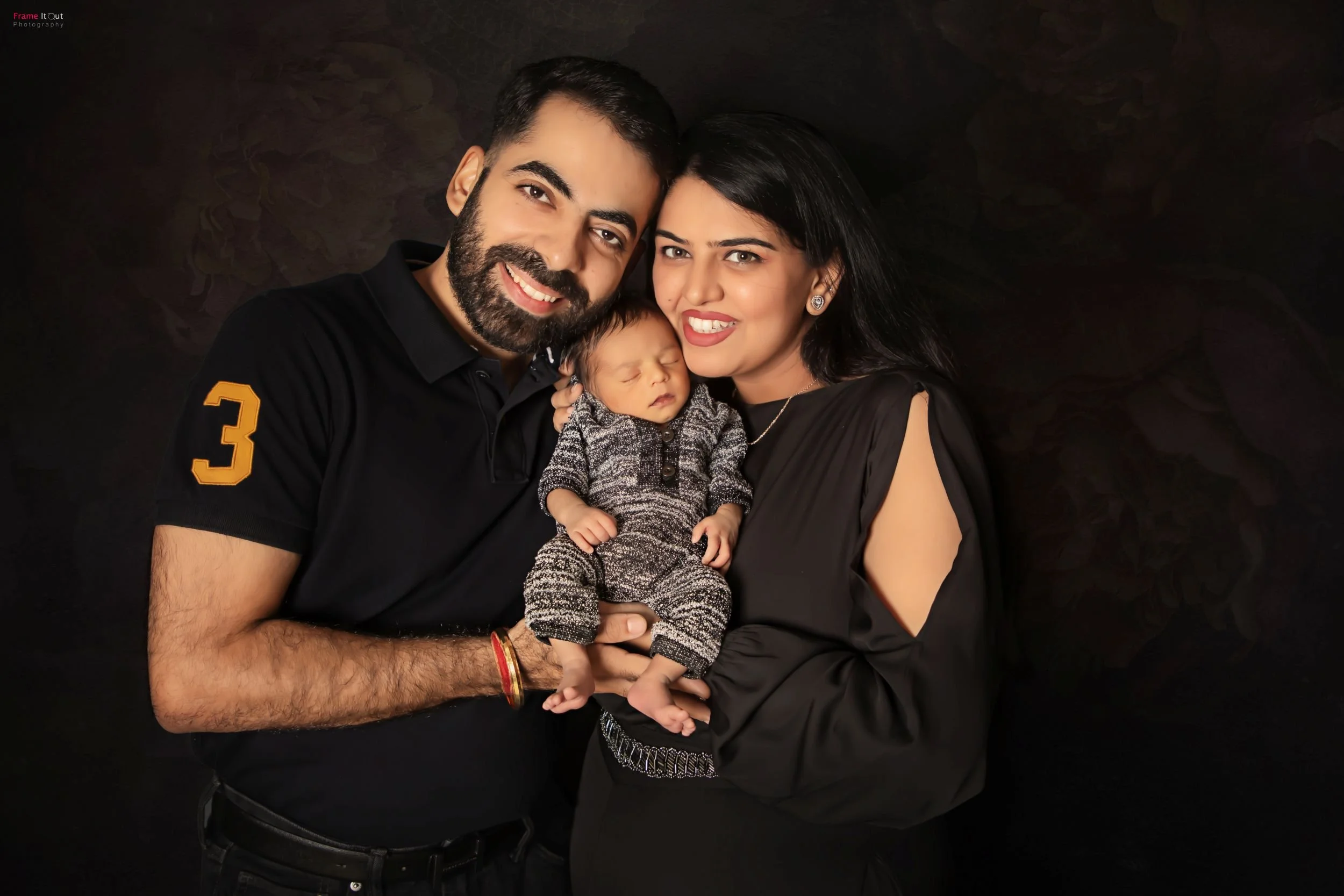 Luxury newborn photography with parents in Delhi NCR by Frame It Out