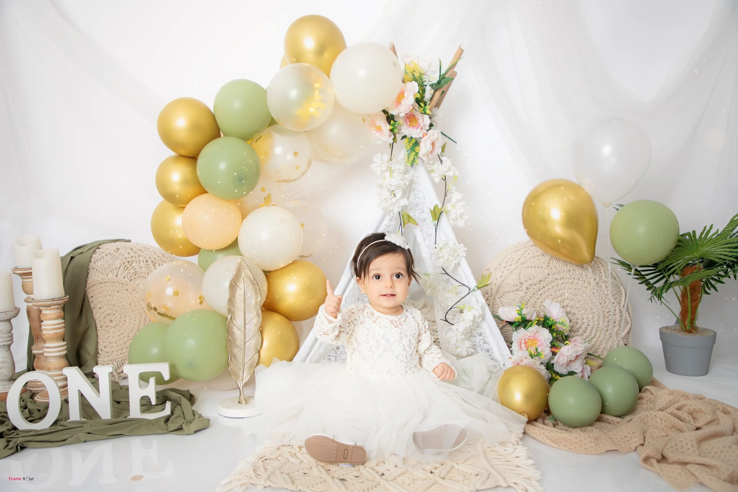 Sitter baby photography capturing joyful expressions and personality at Frame It Out Photography studio in Faridabad, Delhi NCR