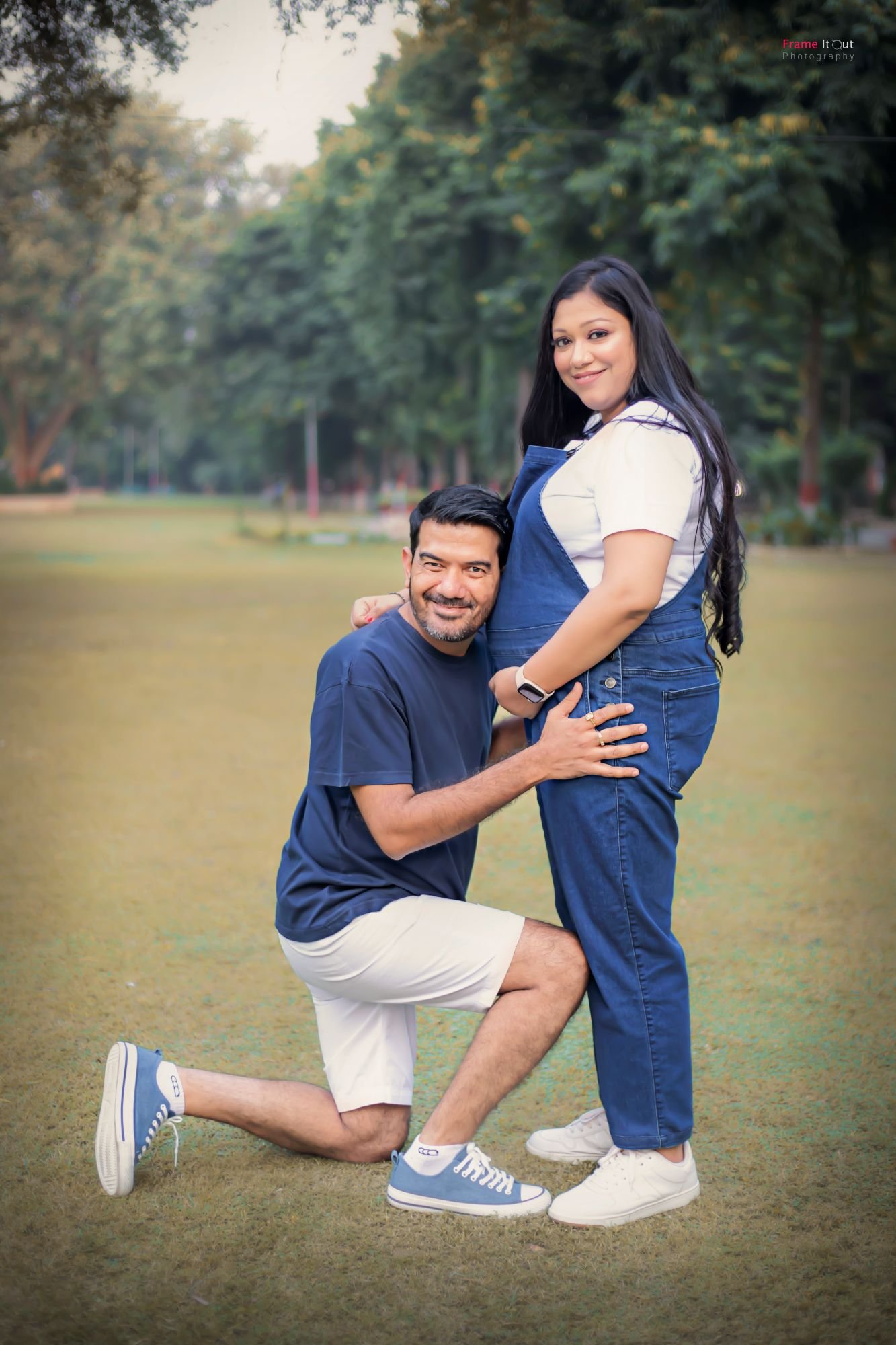 Outdoor-style maternity portrait of couple