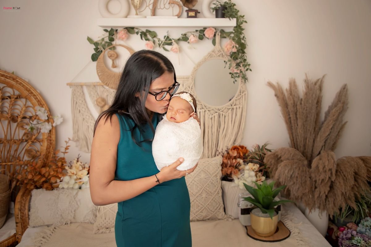 Family portrait with newborn baby at Frame It Out studio Faridabad