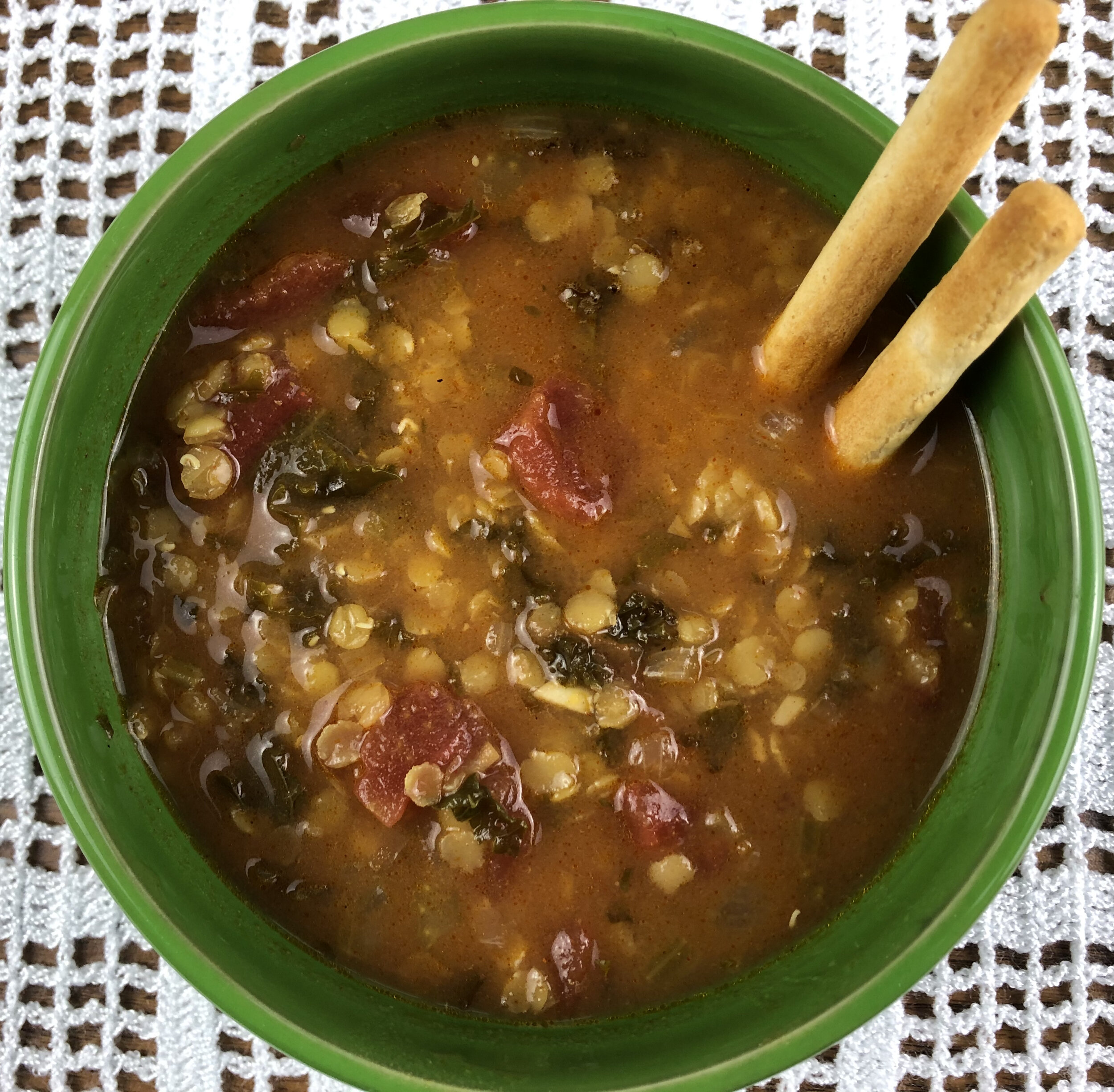 Spiced red lentil, tomato, and kale soup