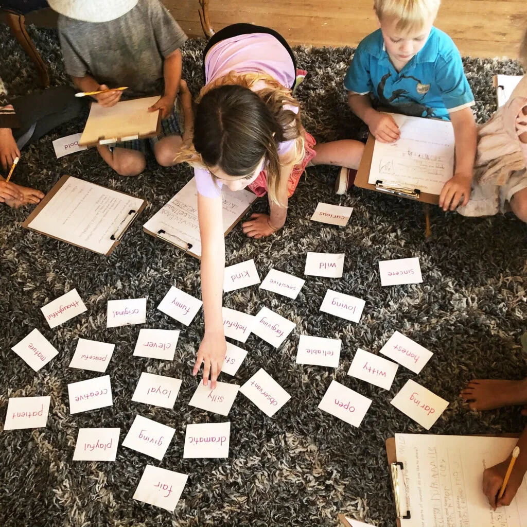 1st & 2nd Grade students selecting vocabulary cards for "Self Portraits From the Inside Out," 2017.