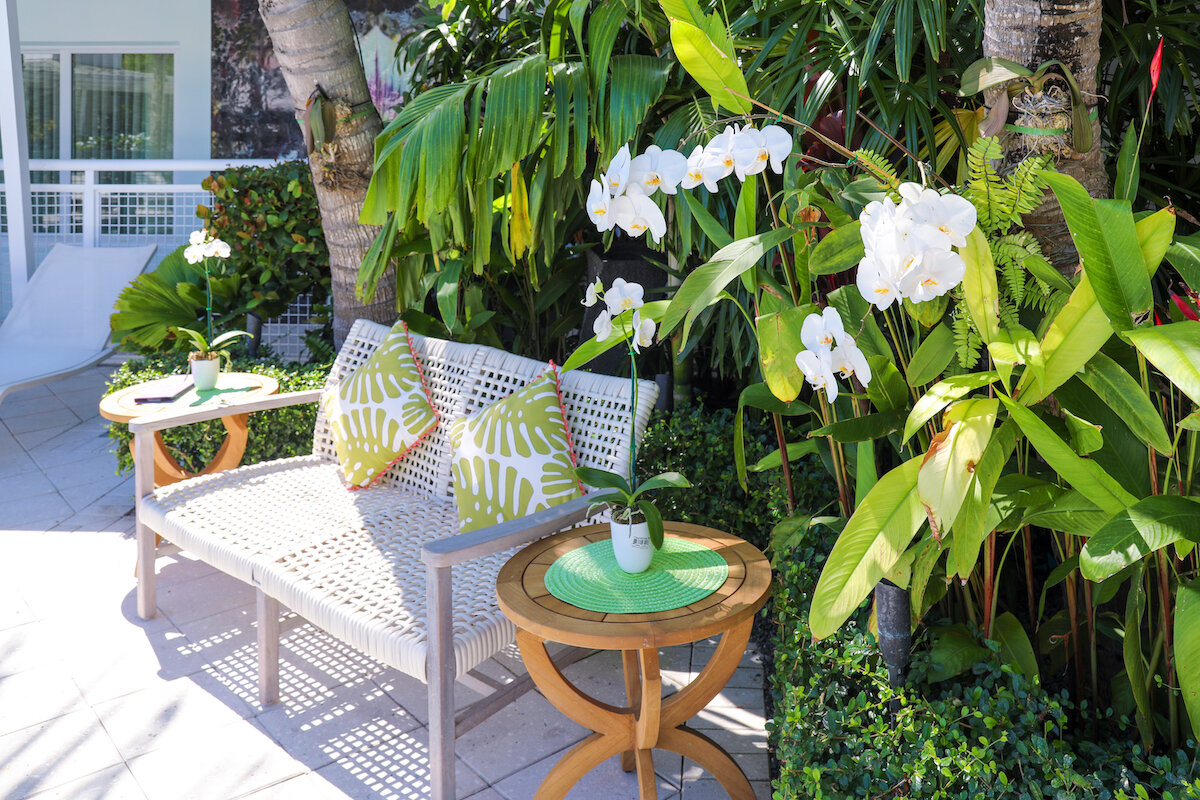outdoor seating areas on the tropical grounds of orchid key inn