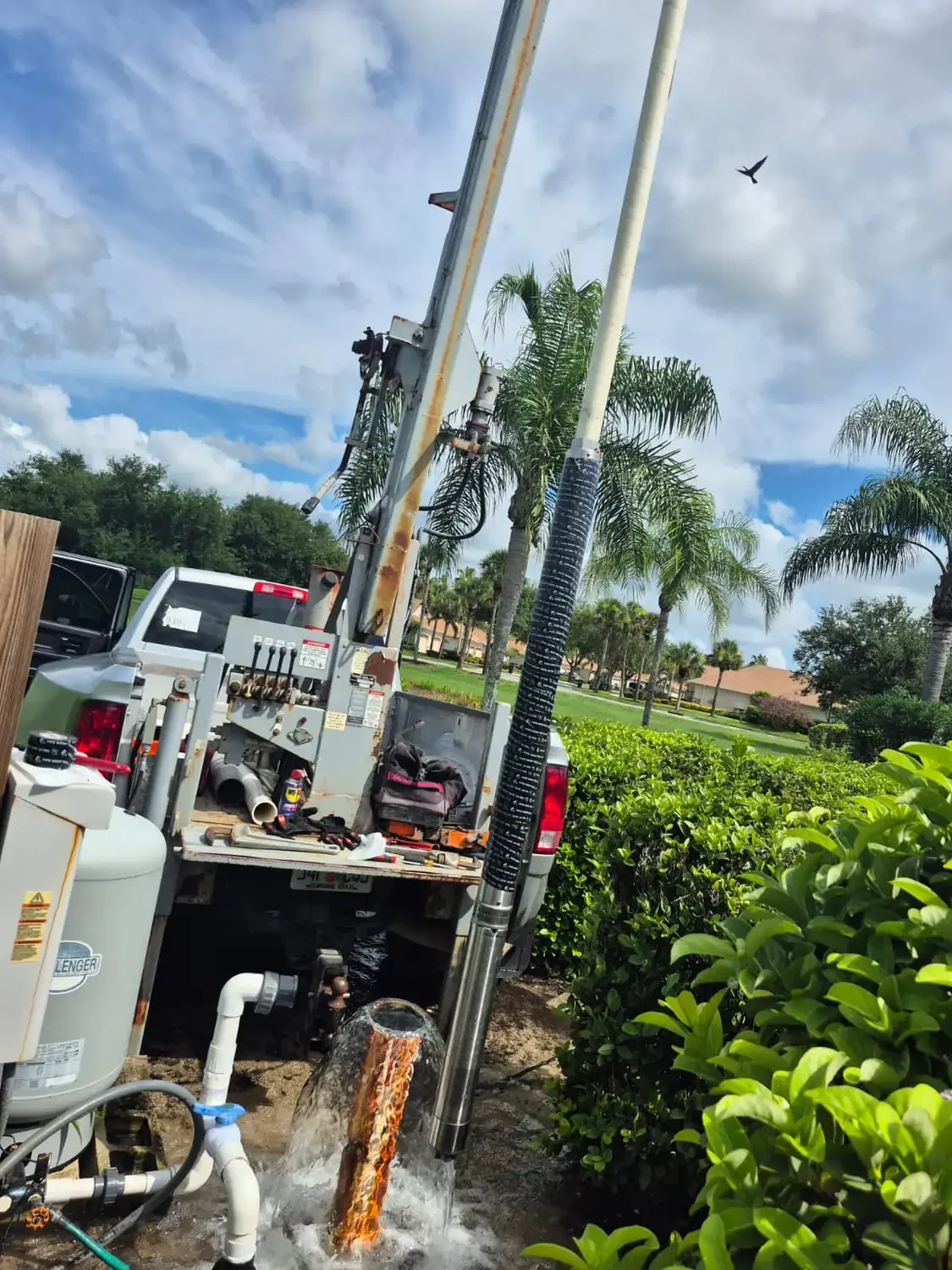 Well installation in progress with a drilling rig on a Florida property