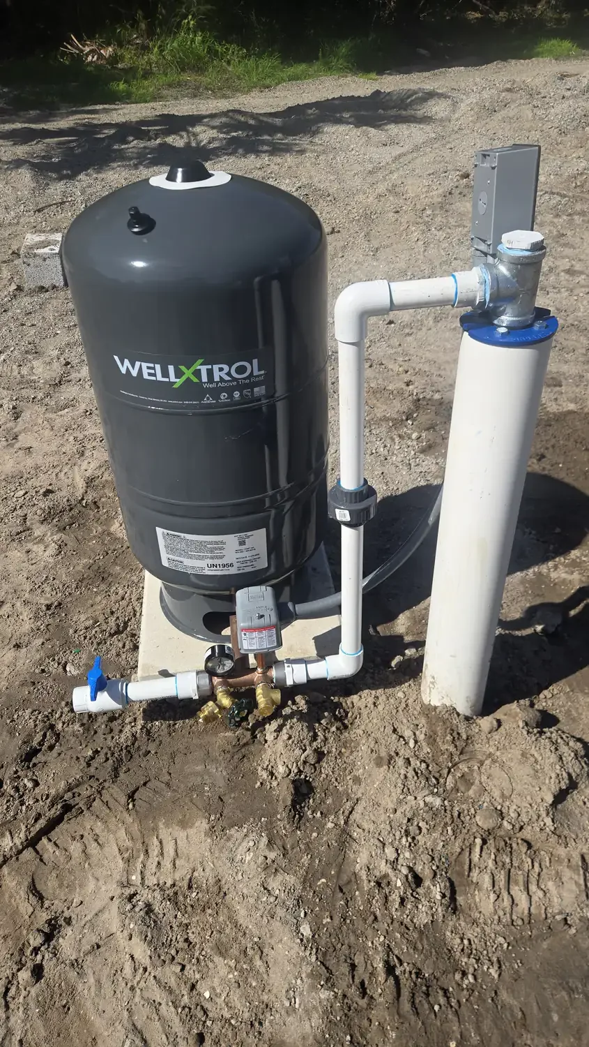 Well water pump repair with a new pressure tank set on the well line