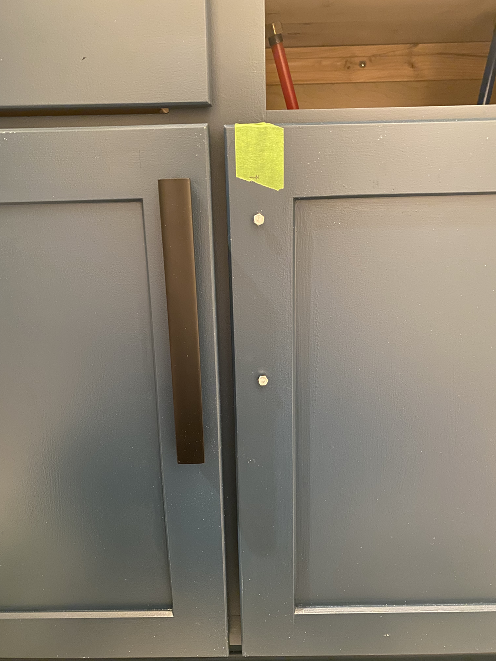 Rip off tape to the top mark, install bolts