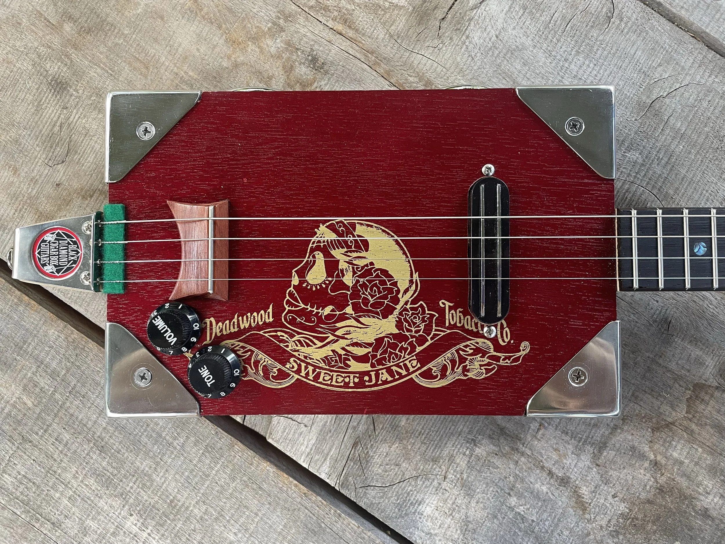 Sweet Jane 4 string fretted cigar box guitar