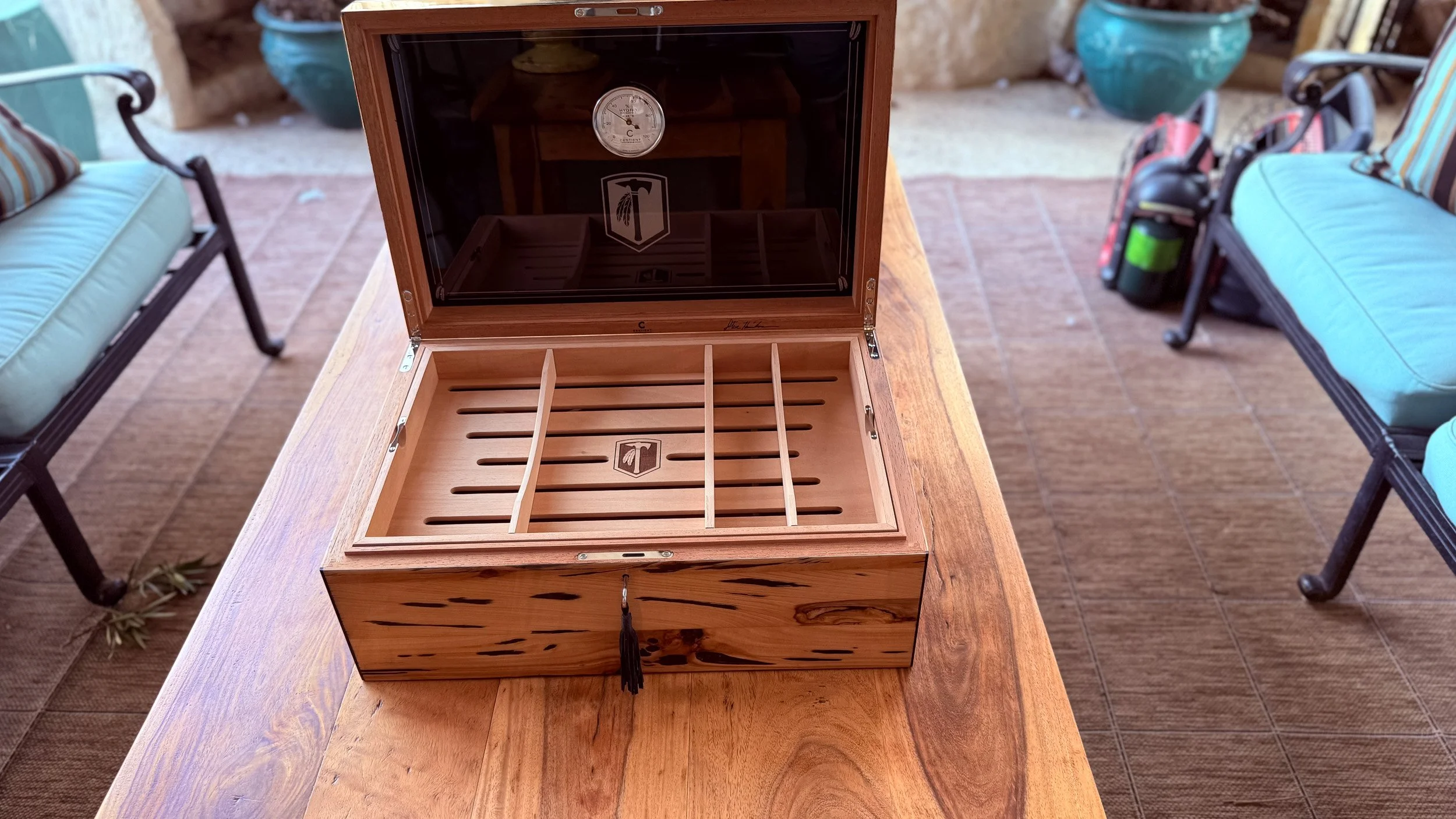 centient-pecky-cypress-humidor-open-outdoor-lifestyle.jpg