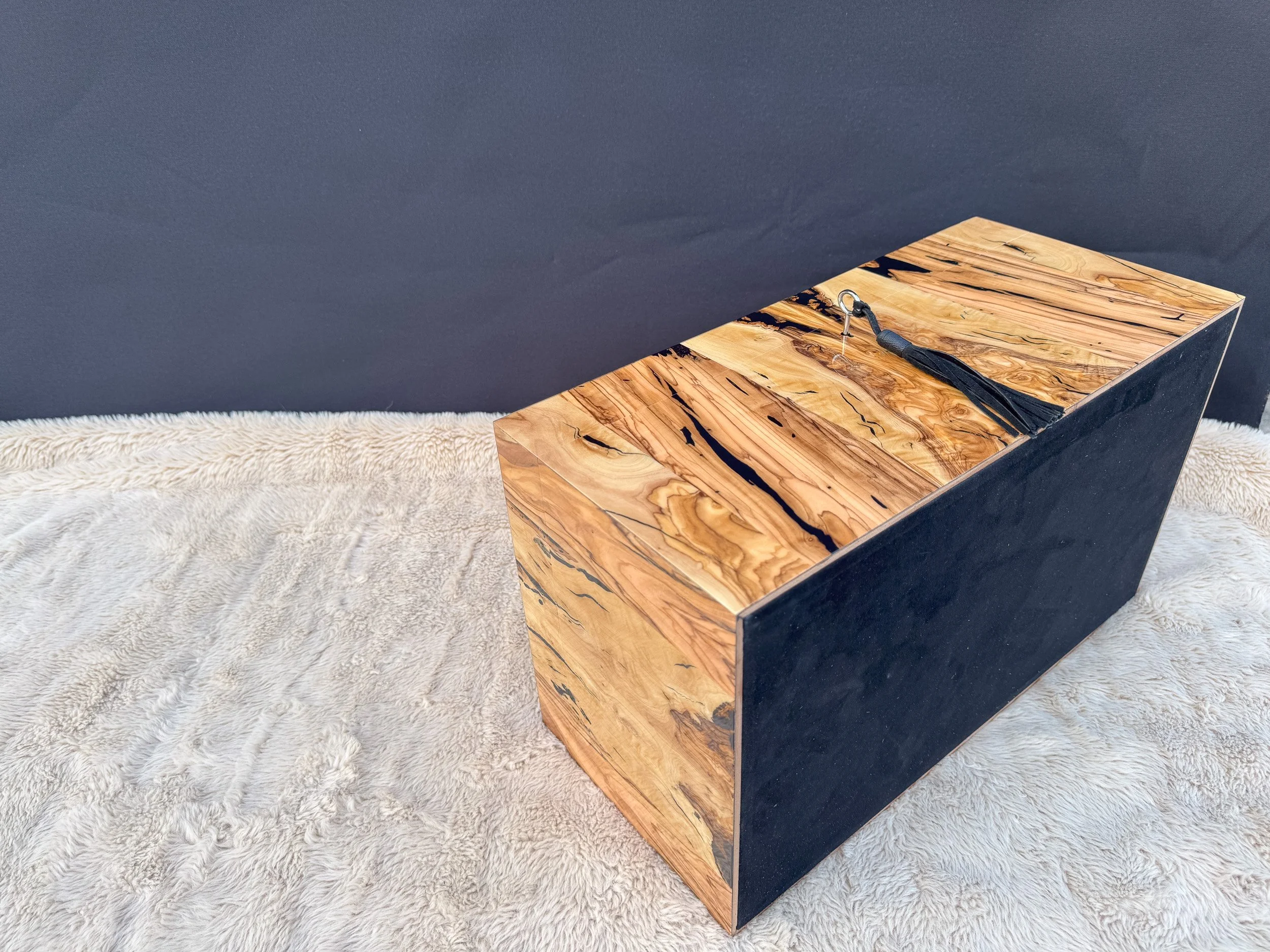 centient-luxury-bethlehem-olivewood-humidor-black-goat-suede-base-angle-view.jpg