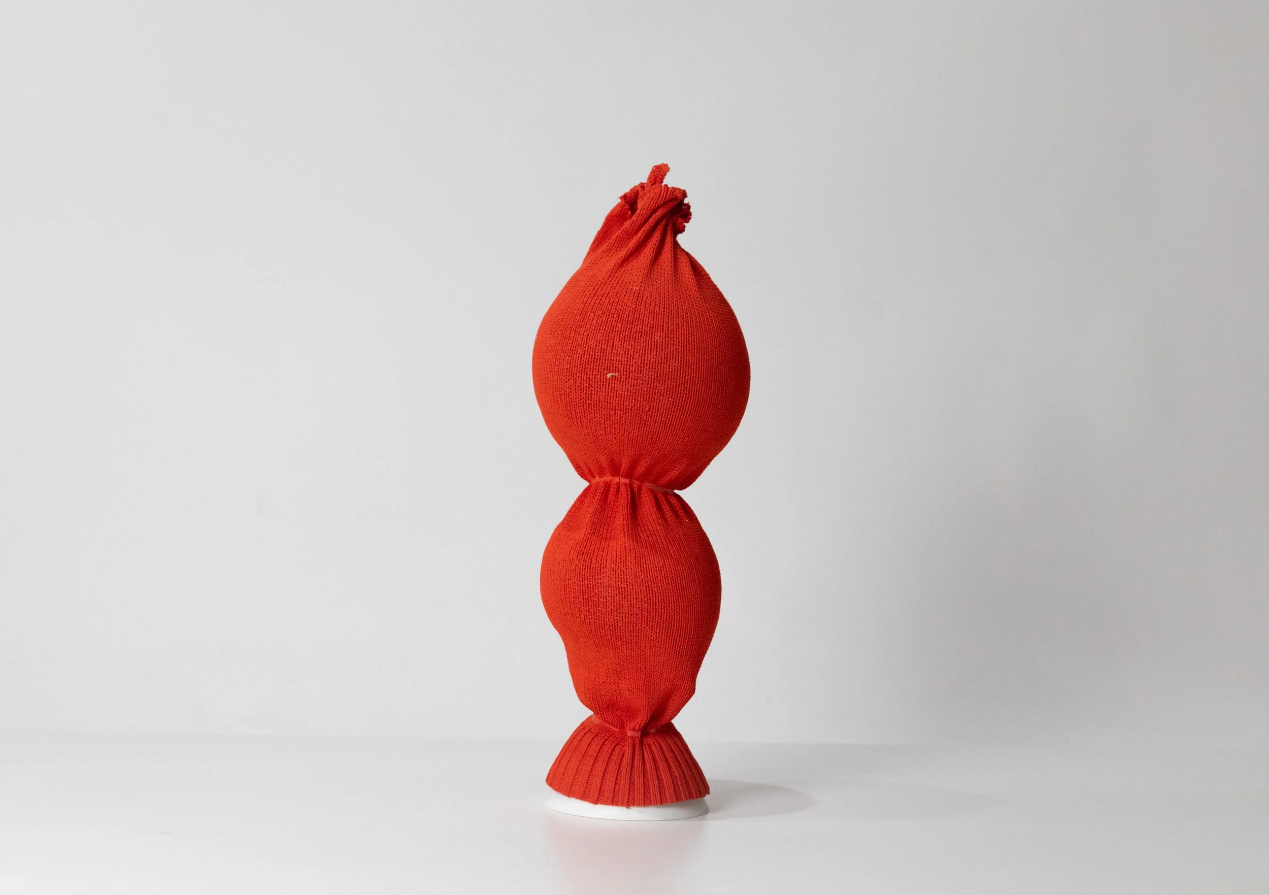 CaraHuato_OrangeTieBauble_2025_KnitBioplastic_10.795cm_£375.jpg